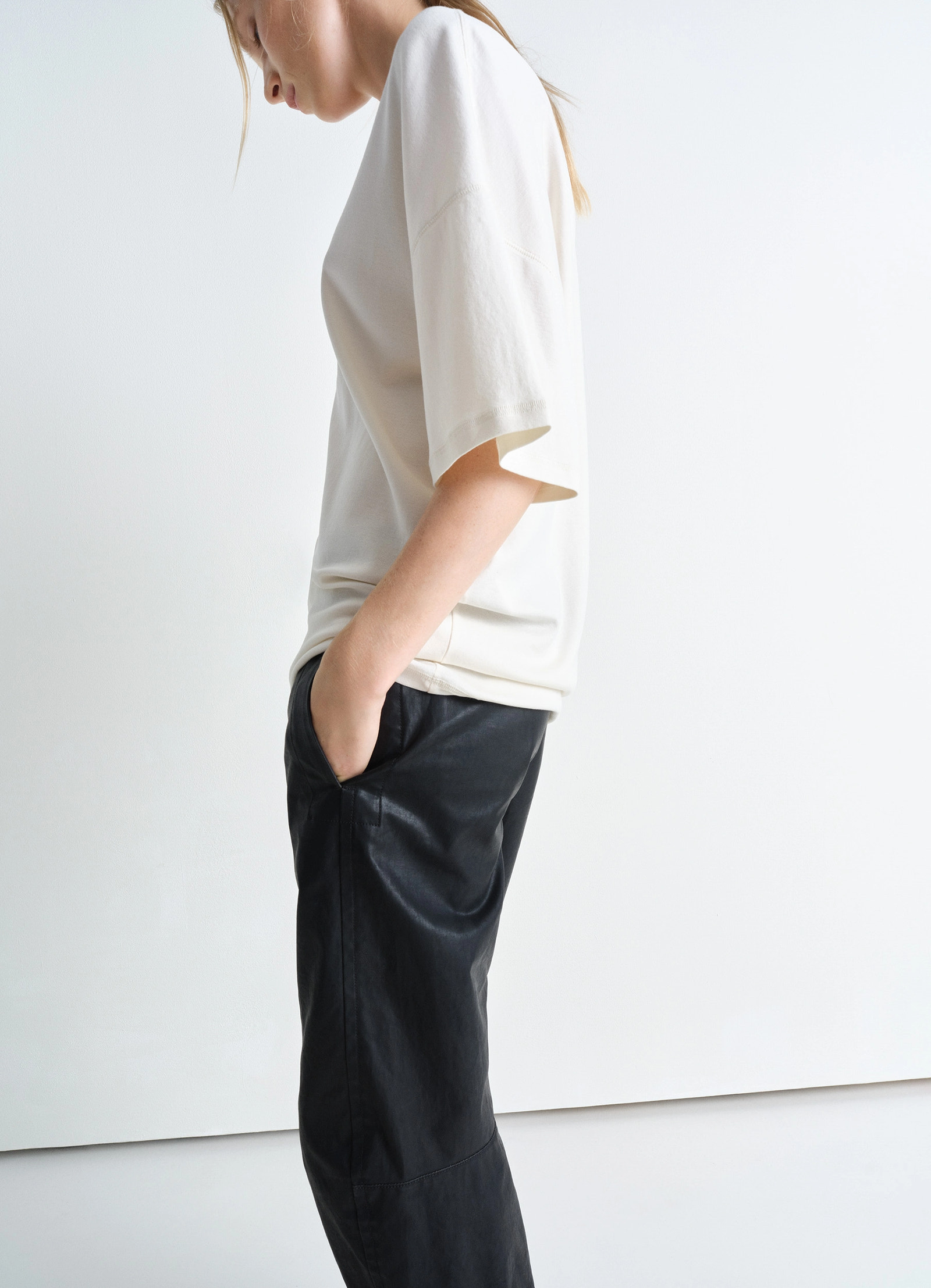 Lemaire rib collar t-shirt in mid-weight cotton jersey, model shot, side view half sleeve, relaxed cut