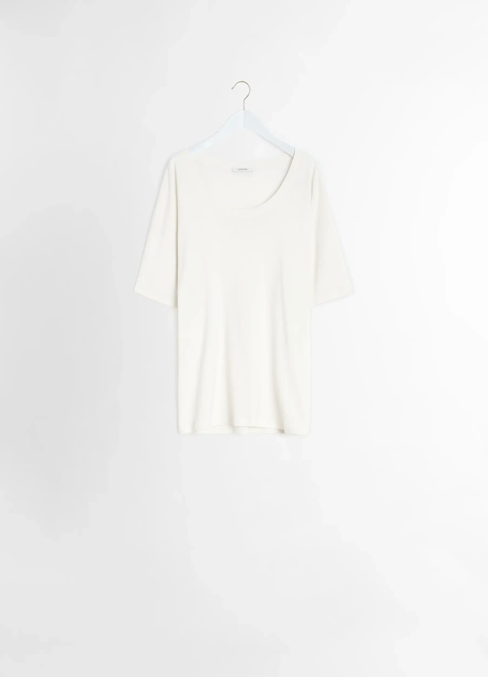 Lemaire rib collar t-shirt in mid-weight cotton jersey, product shot, hanging back view ribbed collar detail
