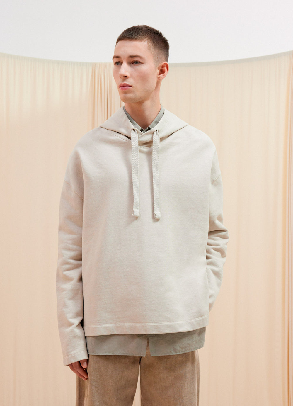 Lemaire Minimal Hoodie in Cotton Linen Blend, model shot, Front side view Loose fit, classic hood