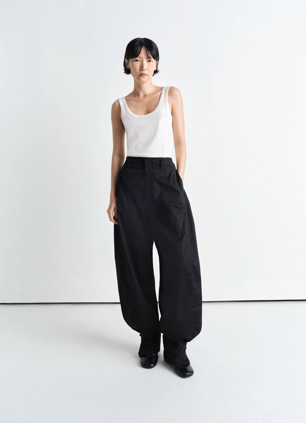 Lemaire Rib Tank Top in Off-White Mid-weight Cotton, model shot, three-quarter view scoop neck worn on model