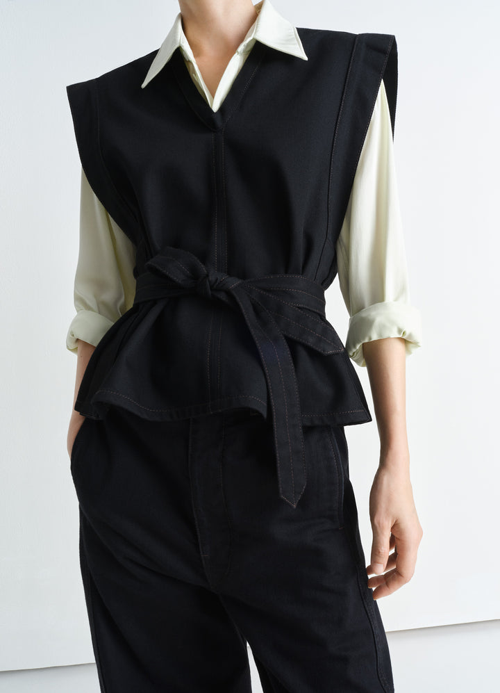 Lemaire Chasuble in Deep Black Twill Denim, model shot, front view V-neck slit armholes