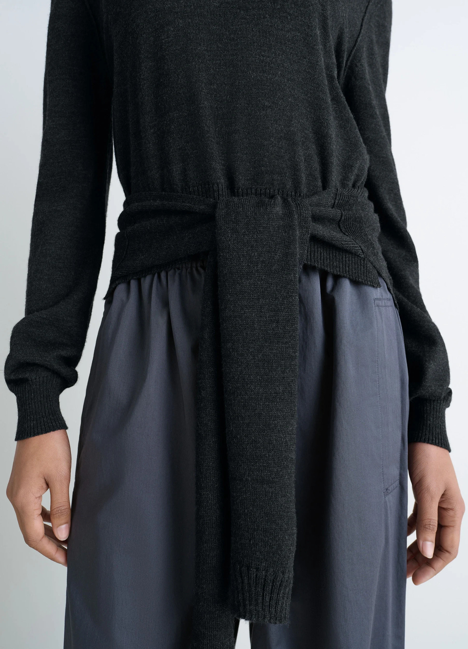 Lemaire trompe loeil jumper in blended merino wool, model shot, waist-level shot tie feature closeup