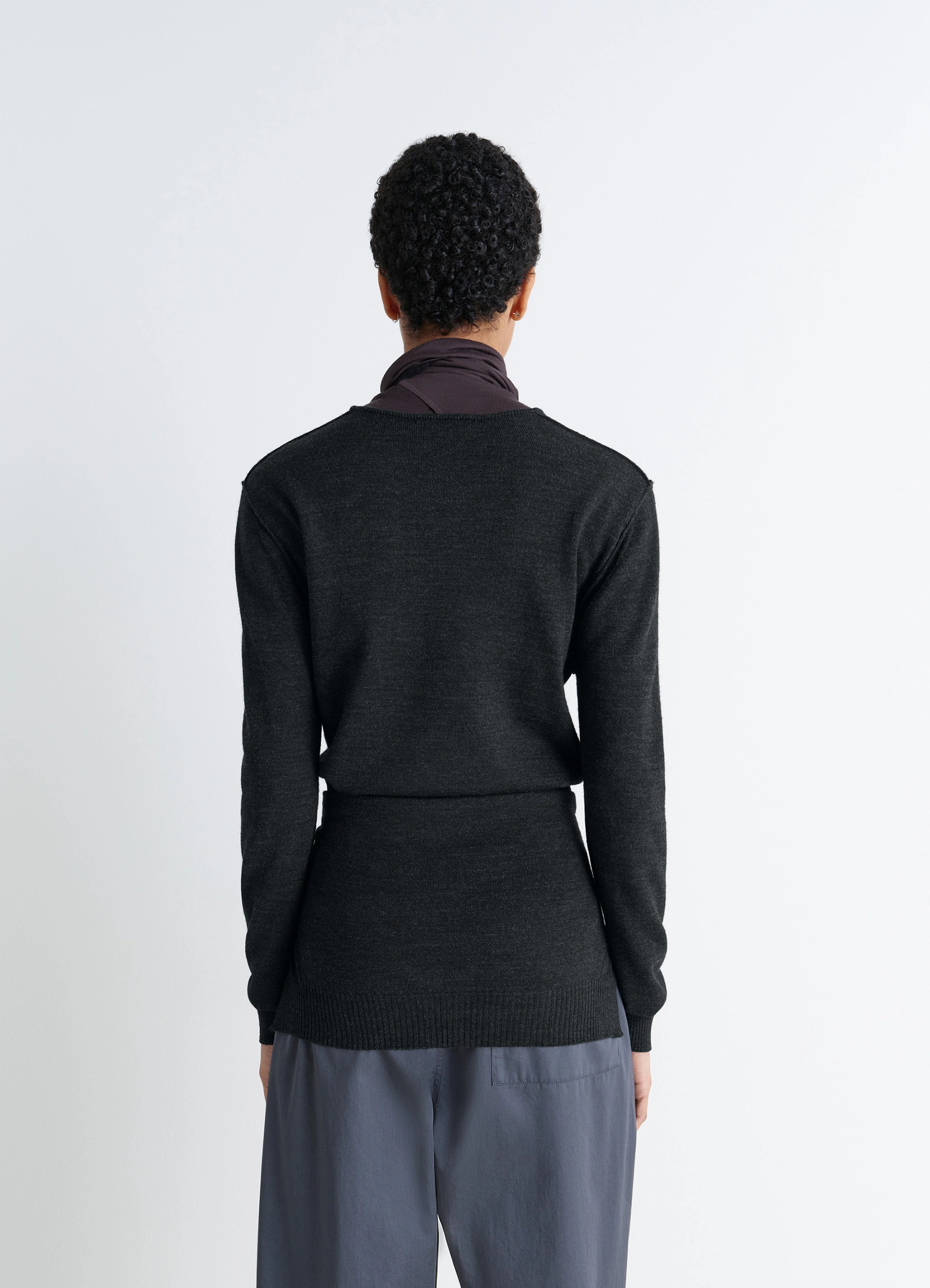 Lemaire trompe loeil jumper in blended merino wool, model shot, back view ribbed hem
