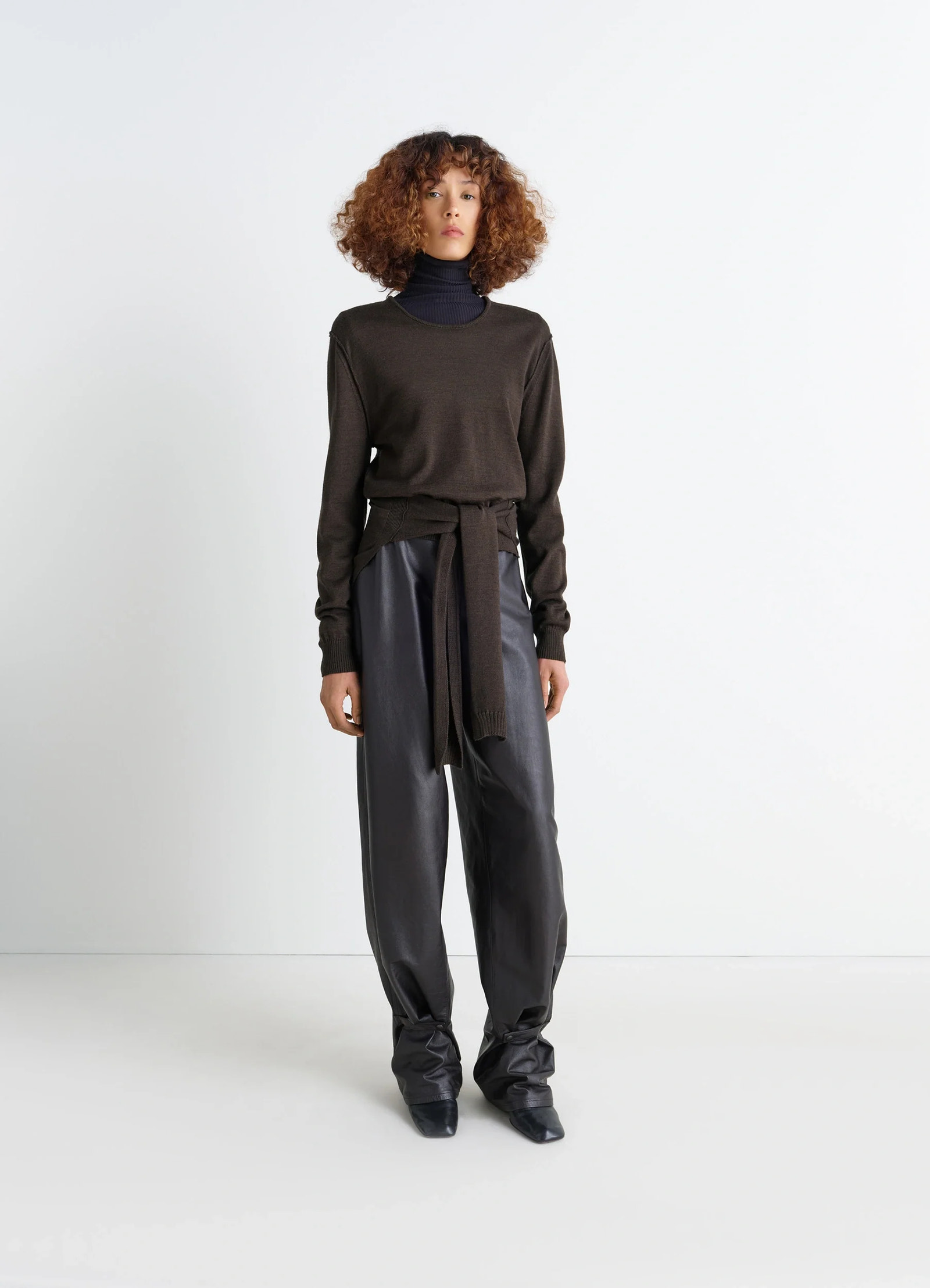 Trompe loeil crew neck jumper in blended merino wool, model shot, full body view belted waist tie