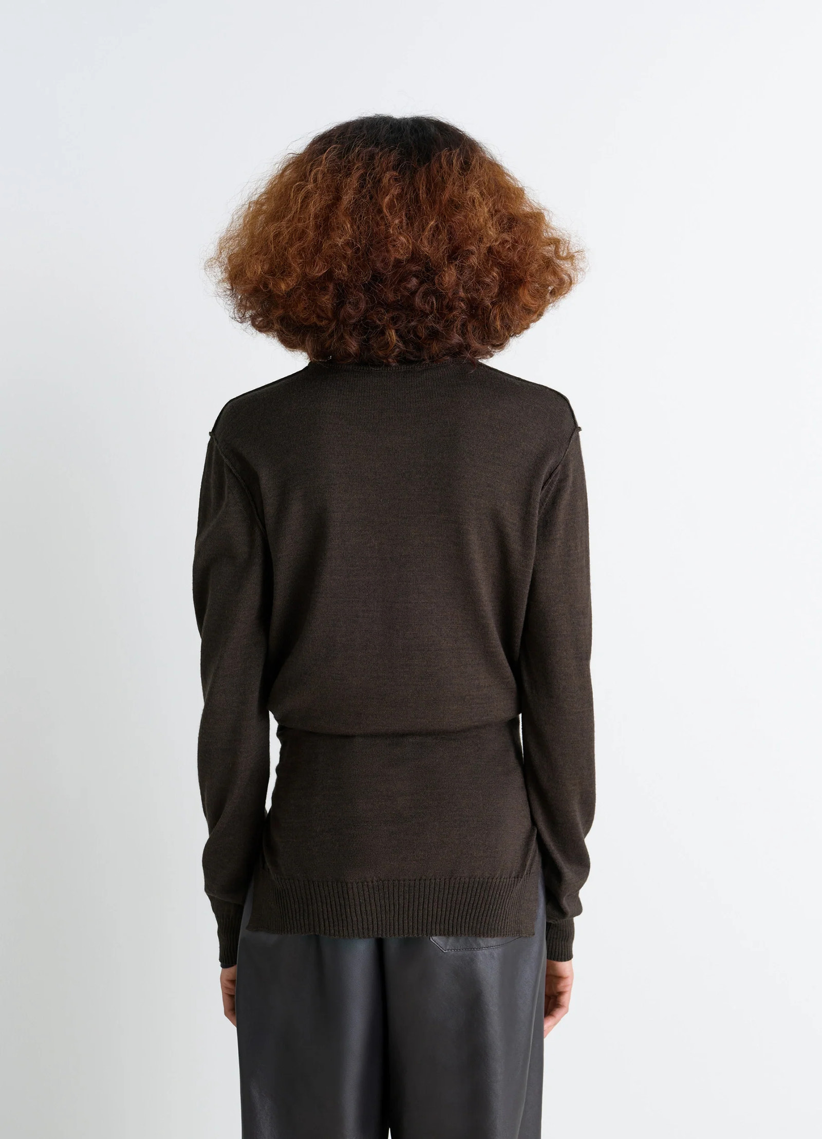 Trompe loeil crew neck jumper in blended merino wool, model shot, back view ribbed hem fitted cut