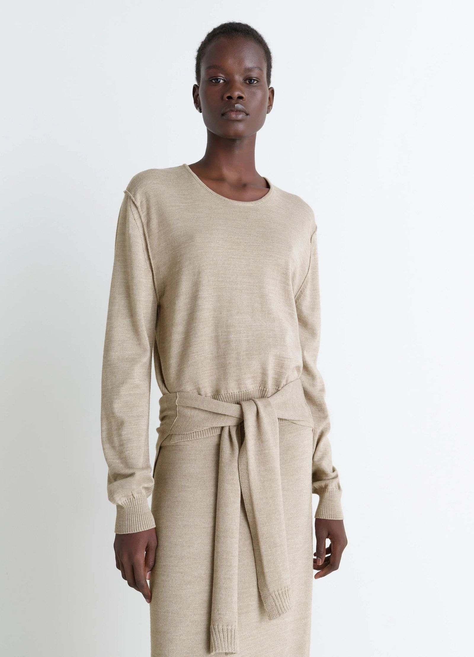 Lemaire trompe loeil crew neck jump in beige blended merino wool, model shot, front view sweater tie-around panels
