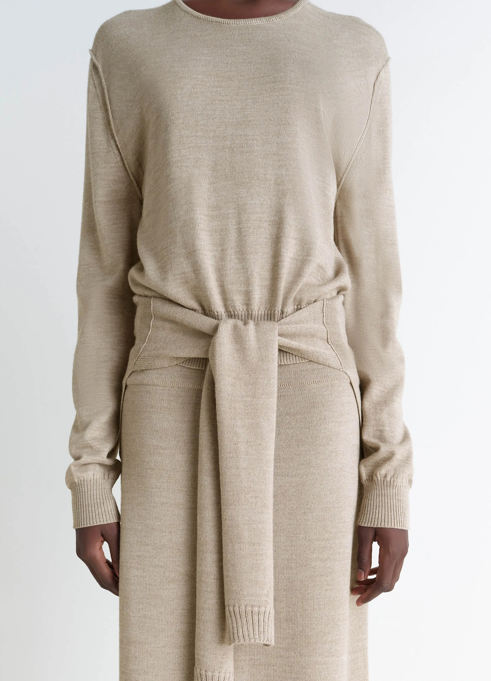 Lemaire trompe loeil crew neck jump in beige blended merino wool, model shot, waist-up front detail ribbed cuffs and hem