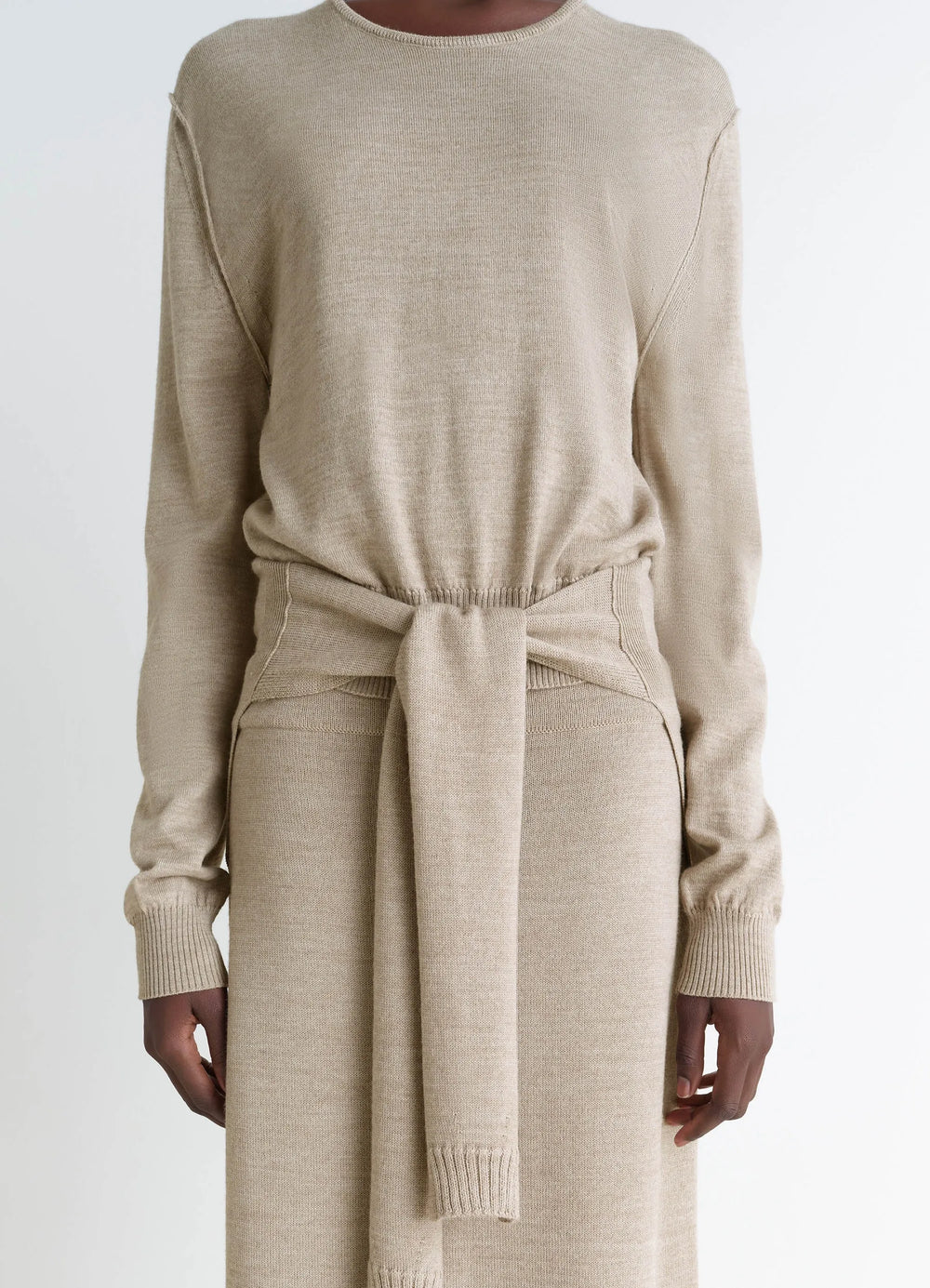Lemaire Trompe LOeil Crew Neck Jump in Beige Blended Merino Wool, model shot, waist-up front detail ribbed cuffs and hem