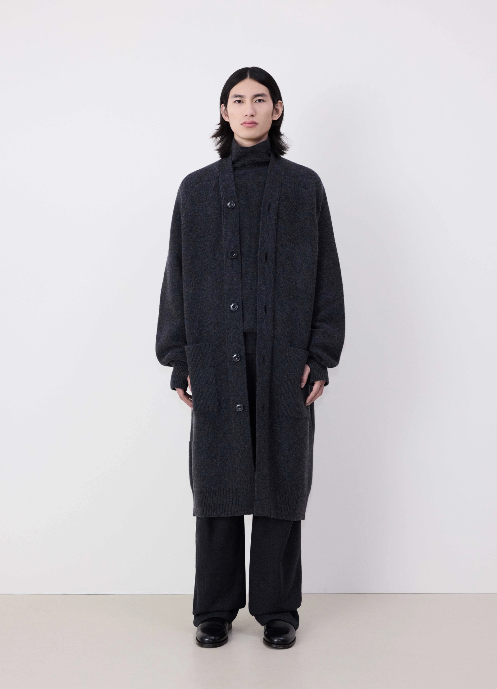 Lemaire long cardigan in dark lambswool, model shot, front view knee-length, robe-inspired