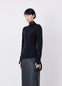 Lemaire Fitted Seamless Cardigan in Black Merino Wool, model shot, Side front view Fitted with thumbholes