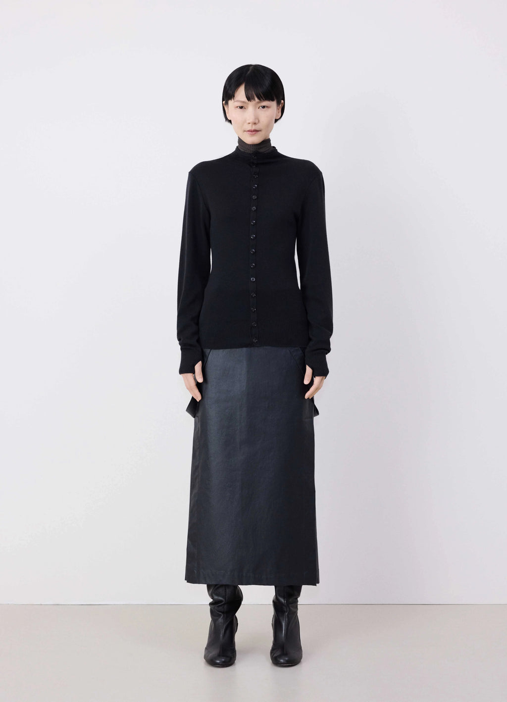 Lemaire Fitted Seamless Cardigan in Black Merino Wool, model shot, front full body view buttoned full sleeves