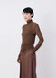 EMO Seamless High Neck Top in viscose silk brown, model shot, side view ribbed, thumbhole cuffs