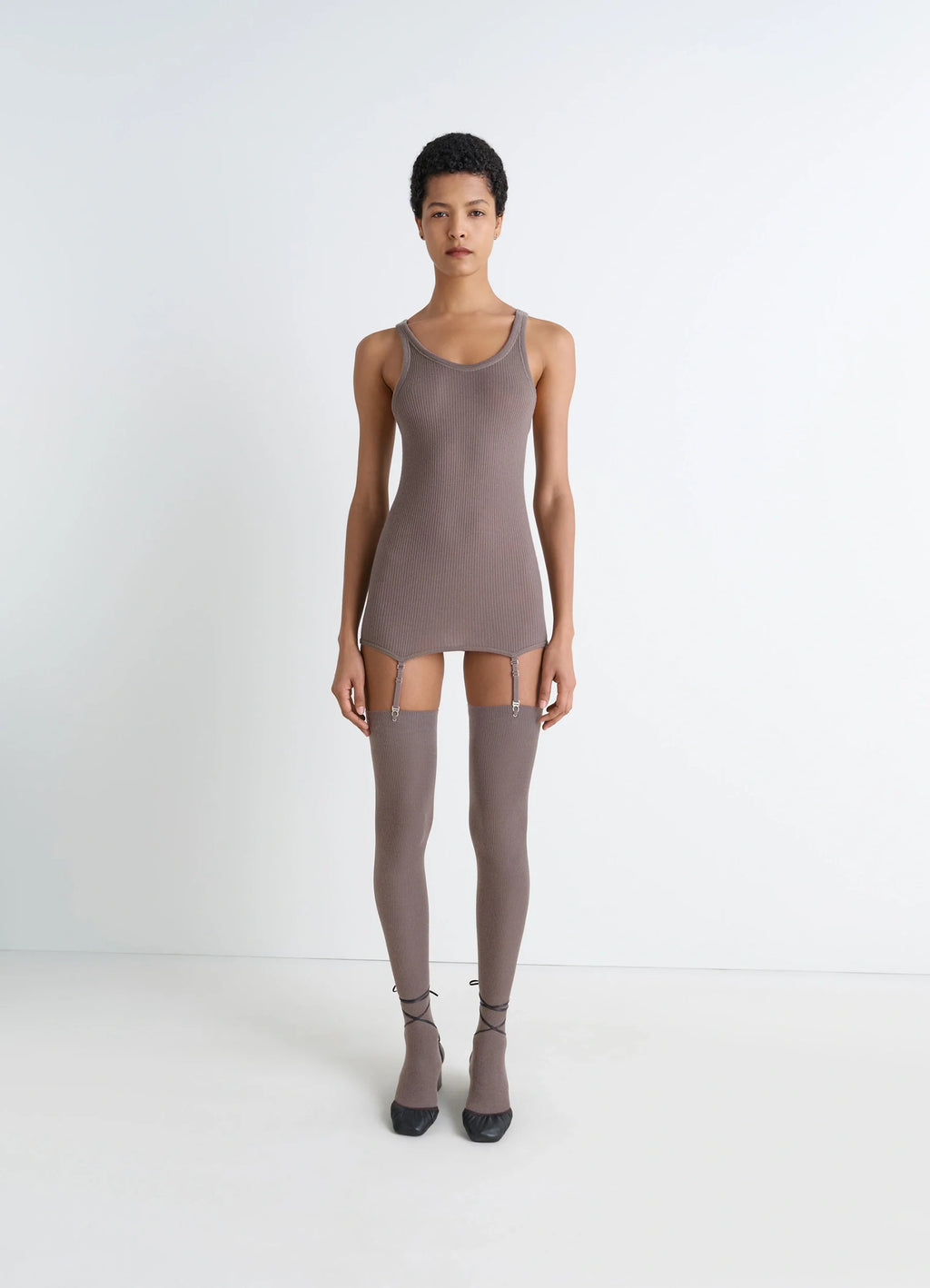 Lemaire Seamless Short Sleeves Tank in Fine Ribbed Merino Wool, model shot, full body front view layered with thigh-high sock