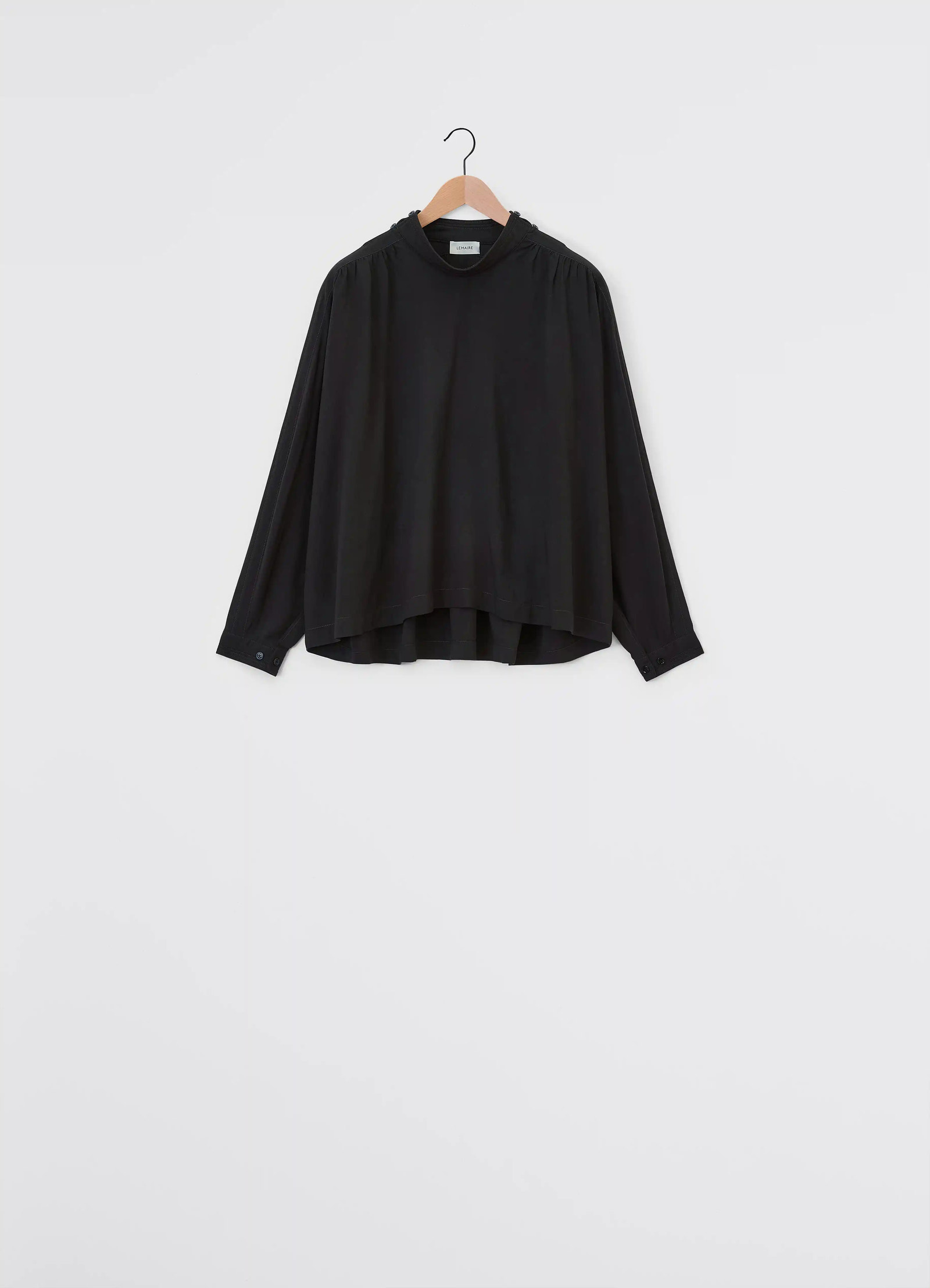 Housse top in viscose and wool blend, product shot, back view asymmetrical hem