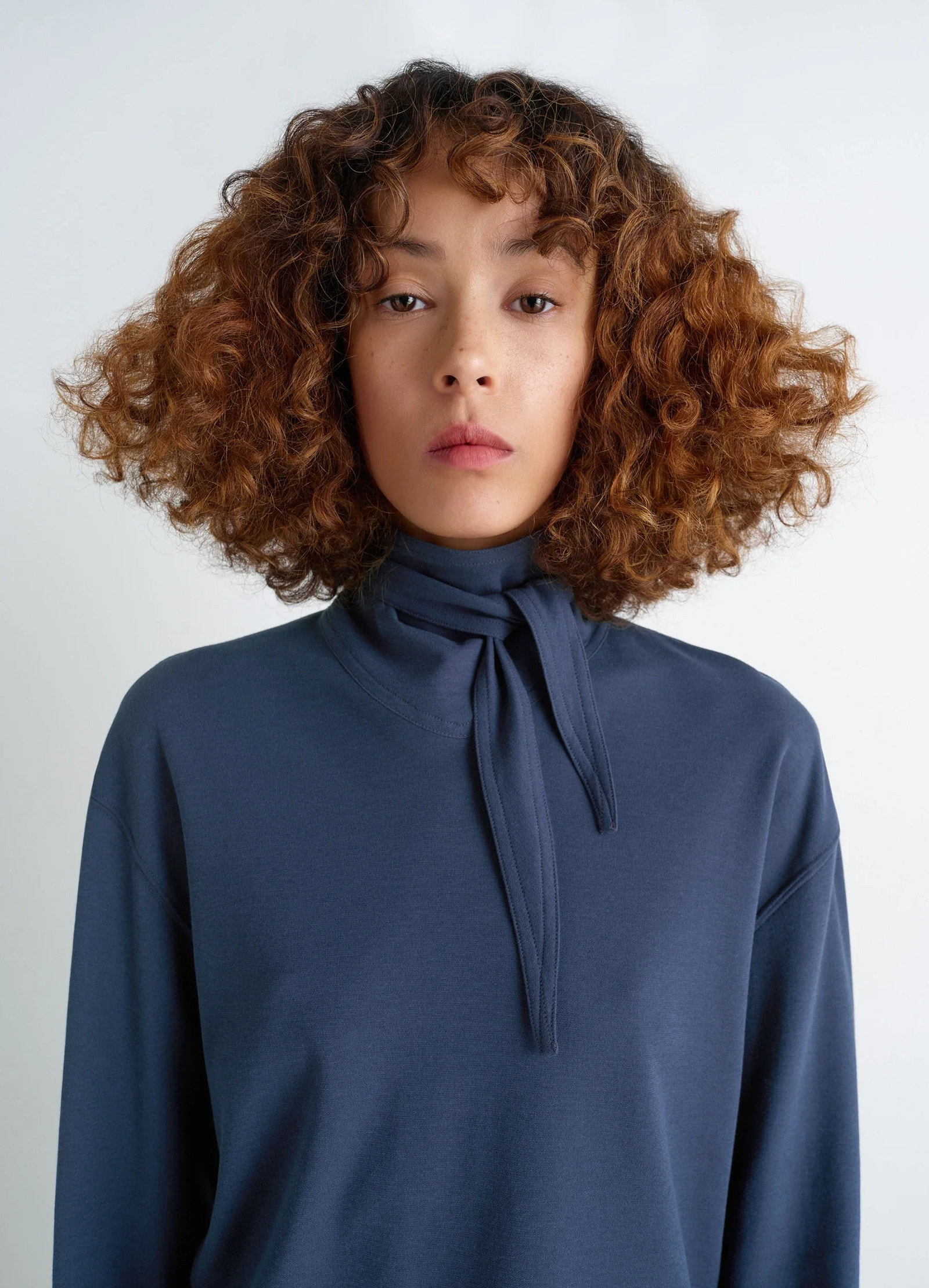 Lemaire long sleeve foulard top in soft-touch crepe jersey, model shot, close-up front view scarf tied, relaxed fit