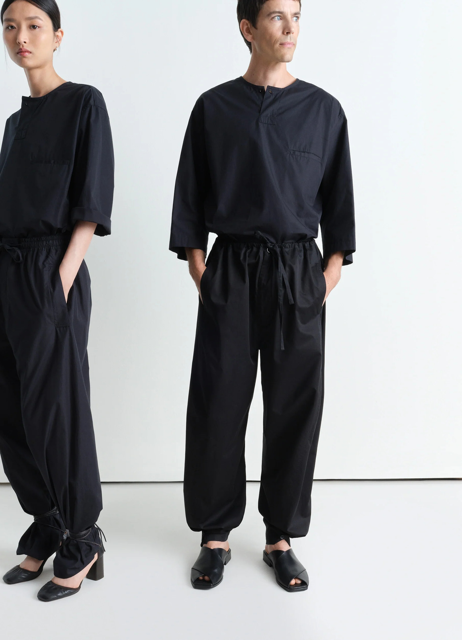 Short sleeve henley top in black heavy cotton poplin, model shot, front view side by side relaxed boxy fit