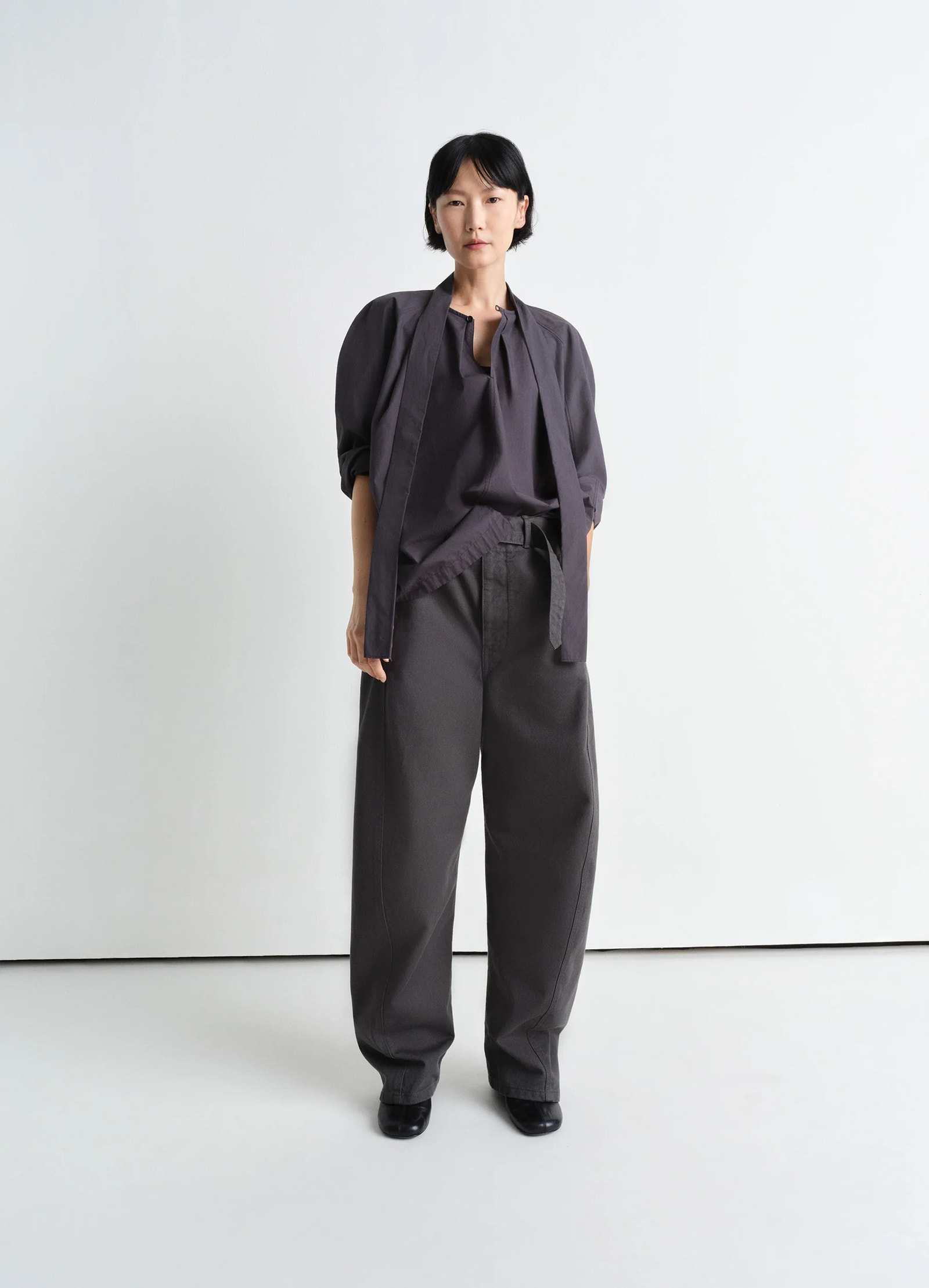 Lemaire ascot blouse in lightweight washed cotton poplin, model shot, three-quarter view billowy sleeves