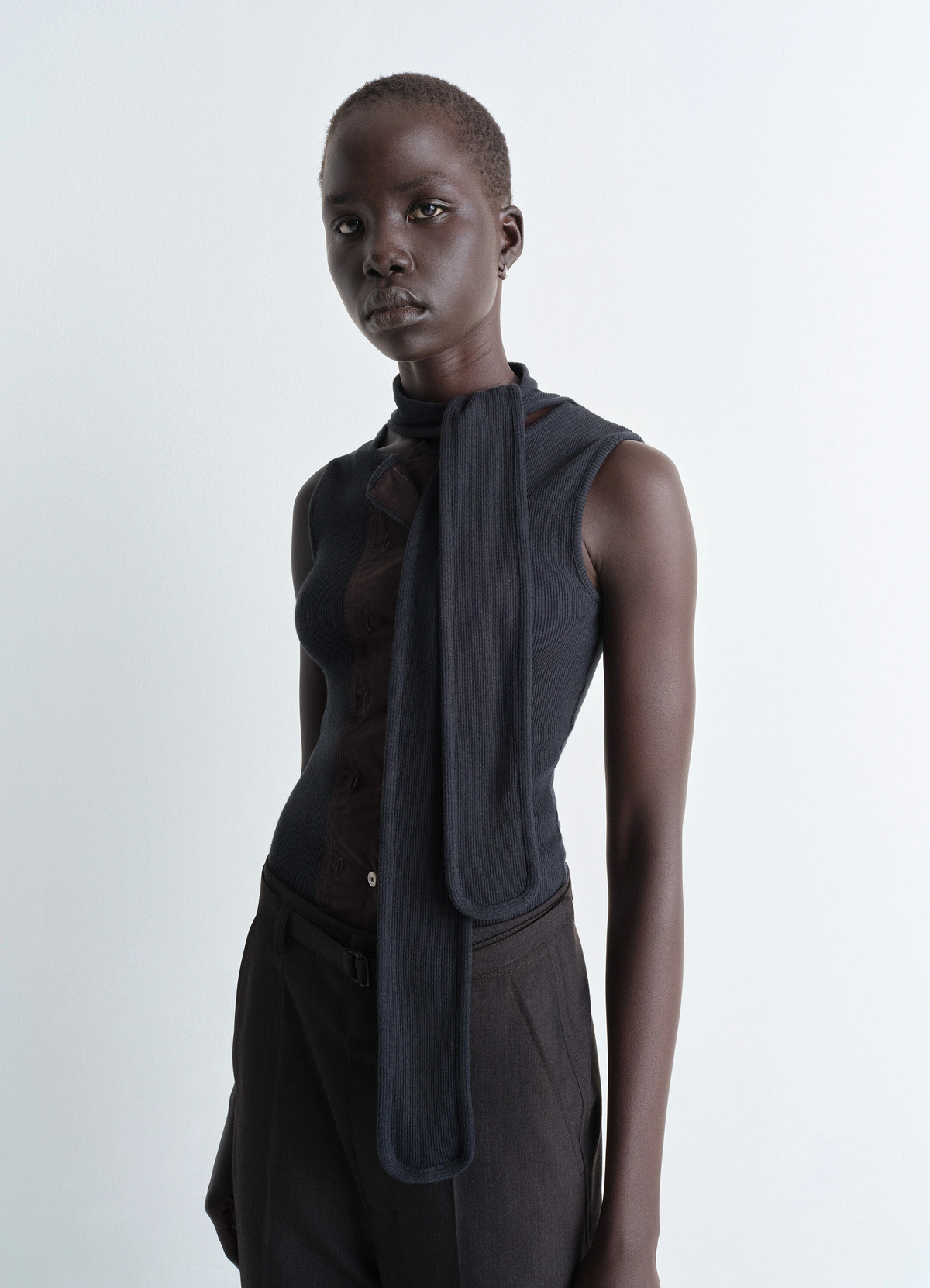 Asymmetrical fitted top in cotton lined rib jersey, model shot, front view sleeveless with neck scarf