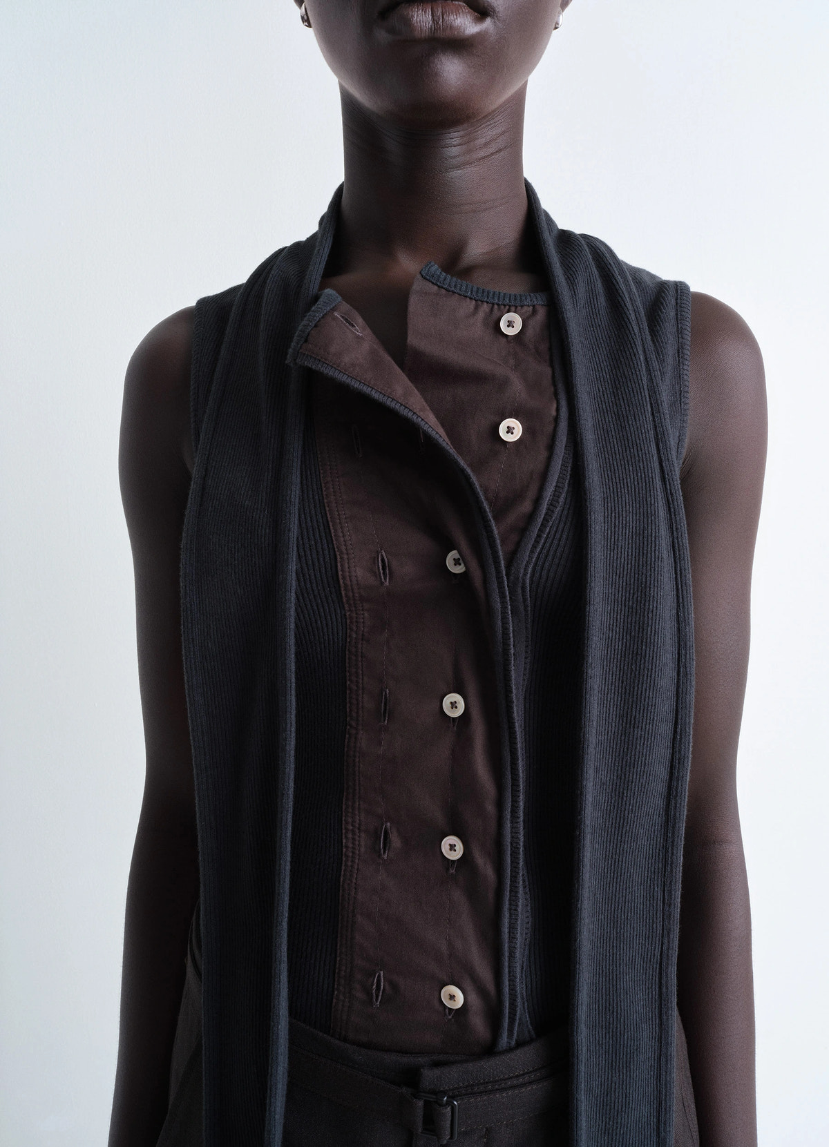Asymmetrical fitted top in cotton lined rib jersey, model shot, close-up detail shot asymmetrical button placket