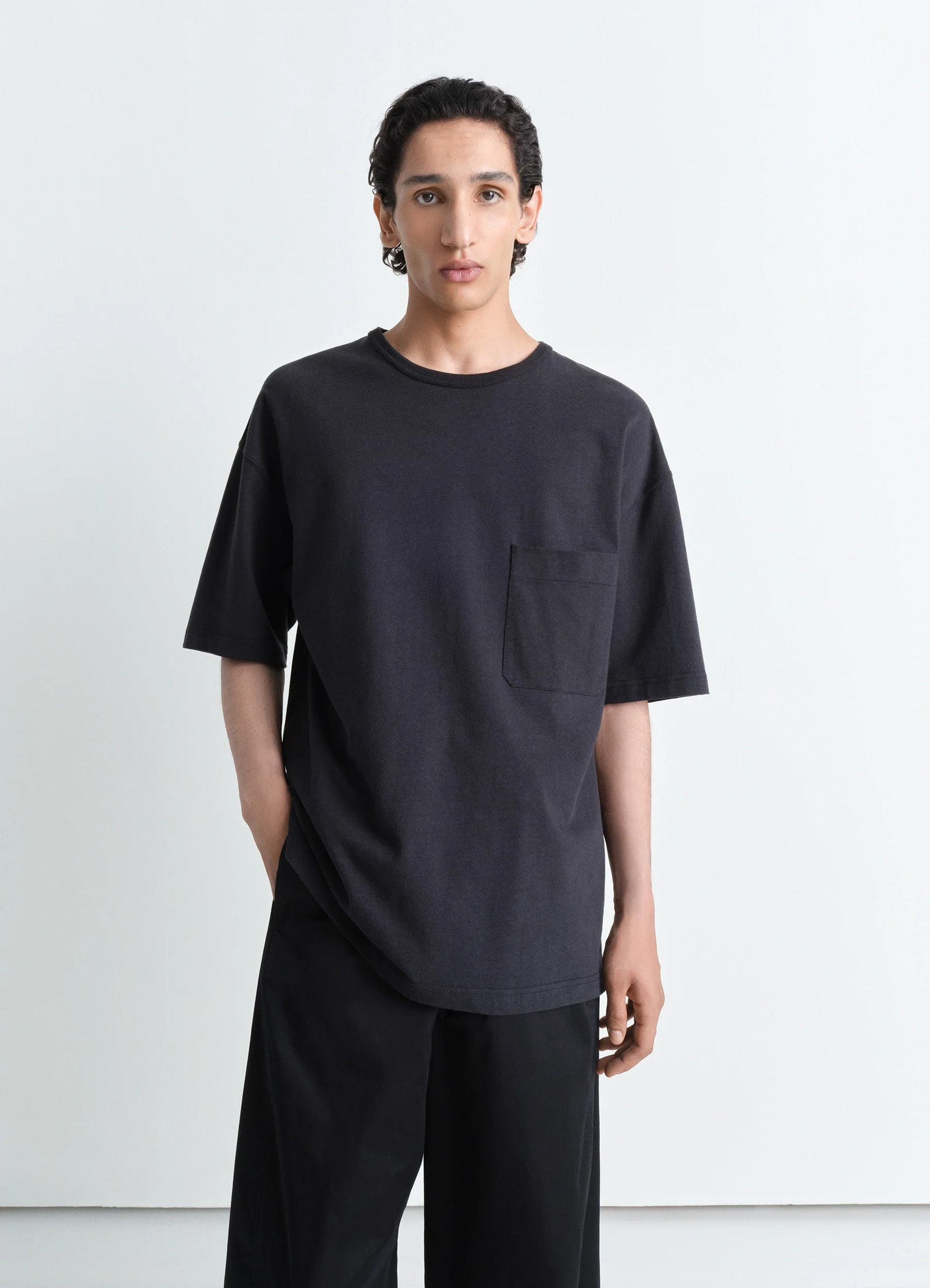 Lemaire boxy short sleeve t-shirt in fluid linen cotton jersey, model shot, front view chest patch pocket, rib neckline