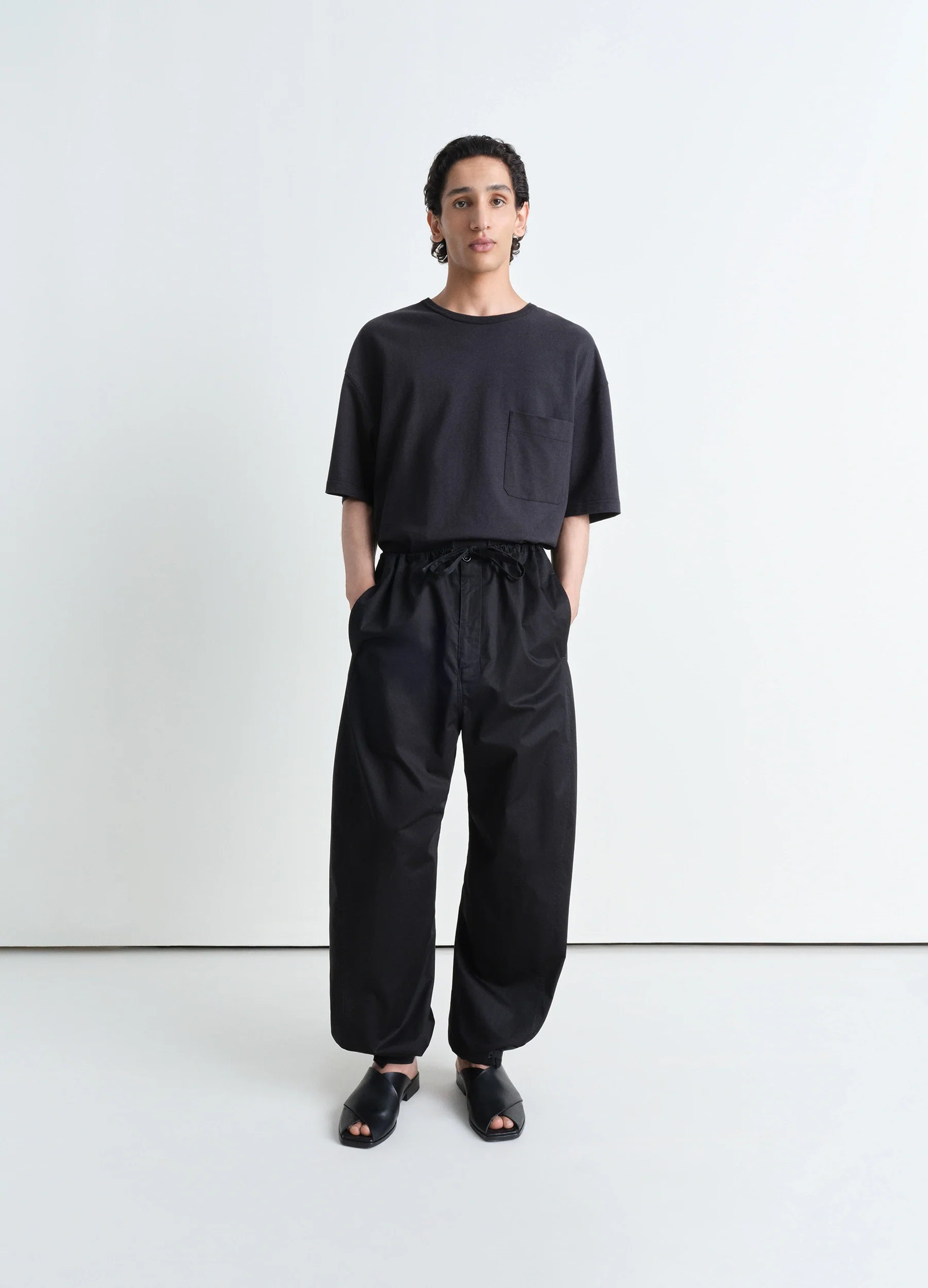 Lemaire boxy short sleeve t-shirt in fluid linen cotton jersey, model shot, full body porte view relaxed fit with dropped sho
