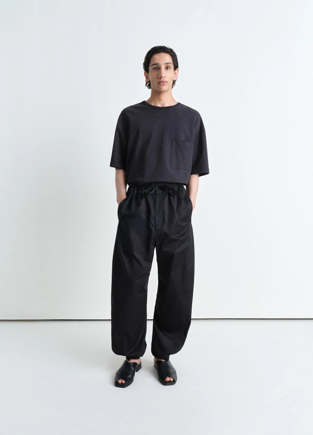 Lemaire Boxy Short Sleeve T-Shirt in Fluid Linen Cotton Jersey, model shot, full body porte view relaxed fit with dropped sho