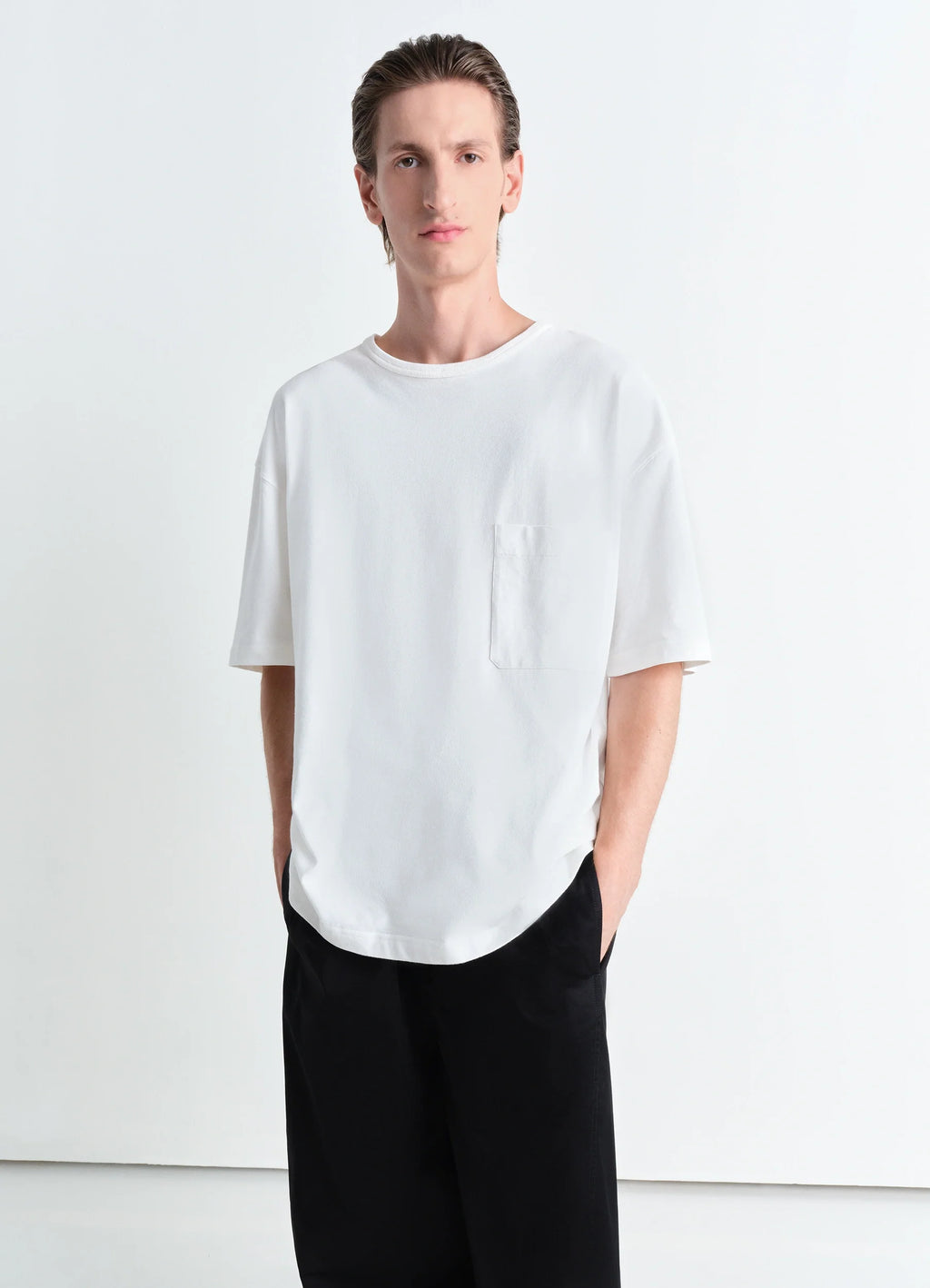 Lemaire Boxy Short Sleeve T-shirt in White Linen Cotton Jersey, model shot, front view patch pocket, rib neckline