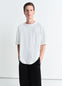 Lemaire Boxy Short Sleeve T-shirt in White Linen Cotton Jersey, model shot, front view patch pocket, rib neckline