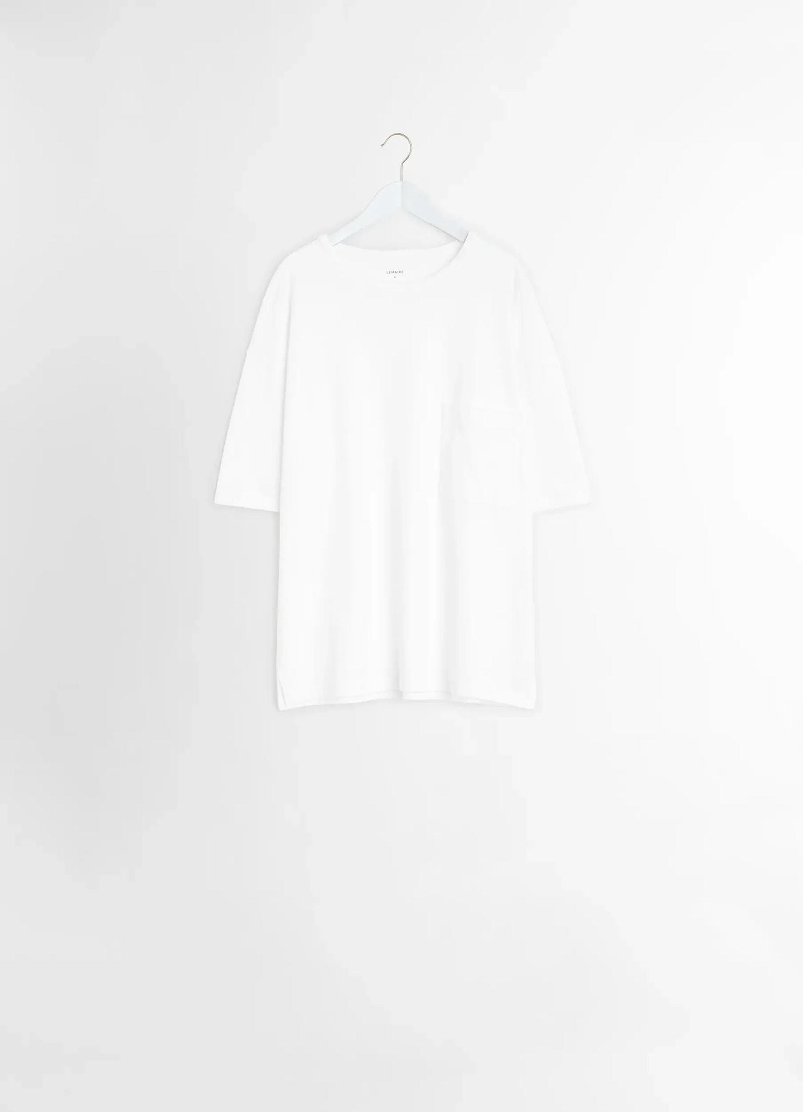 Lemaire boxy short sleeve t-shirt in white linen cotton jersey, product shot, hanger display view straight cut hem visible