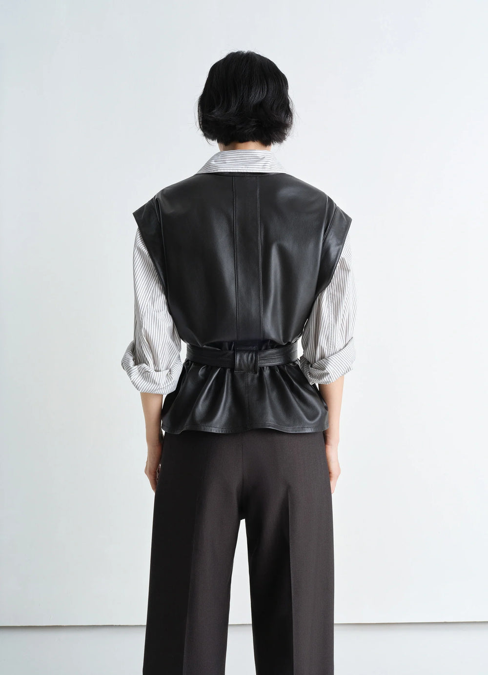 Lemaire Leather Chasuble in Light Lamb Leather, model shot, back view belted pleated back