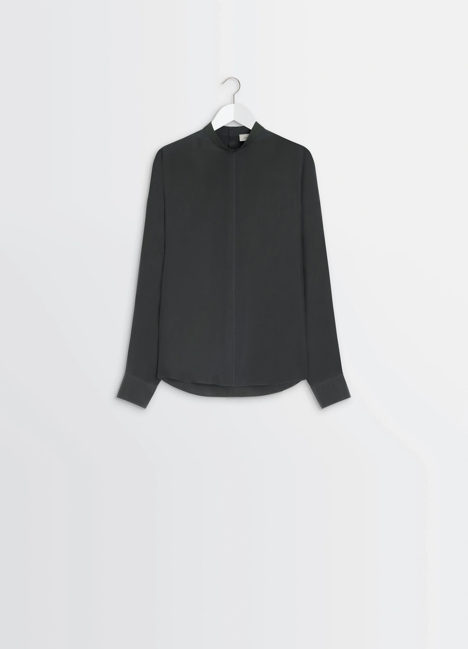Light plastron top in black silk pongee, product shot, side detail view straight front seam, high cuffs