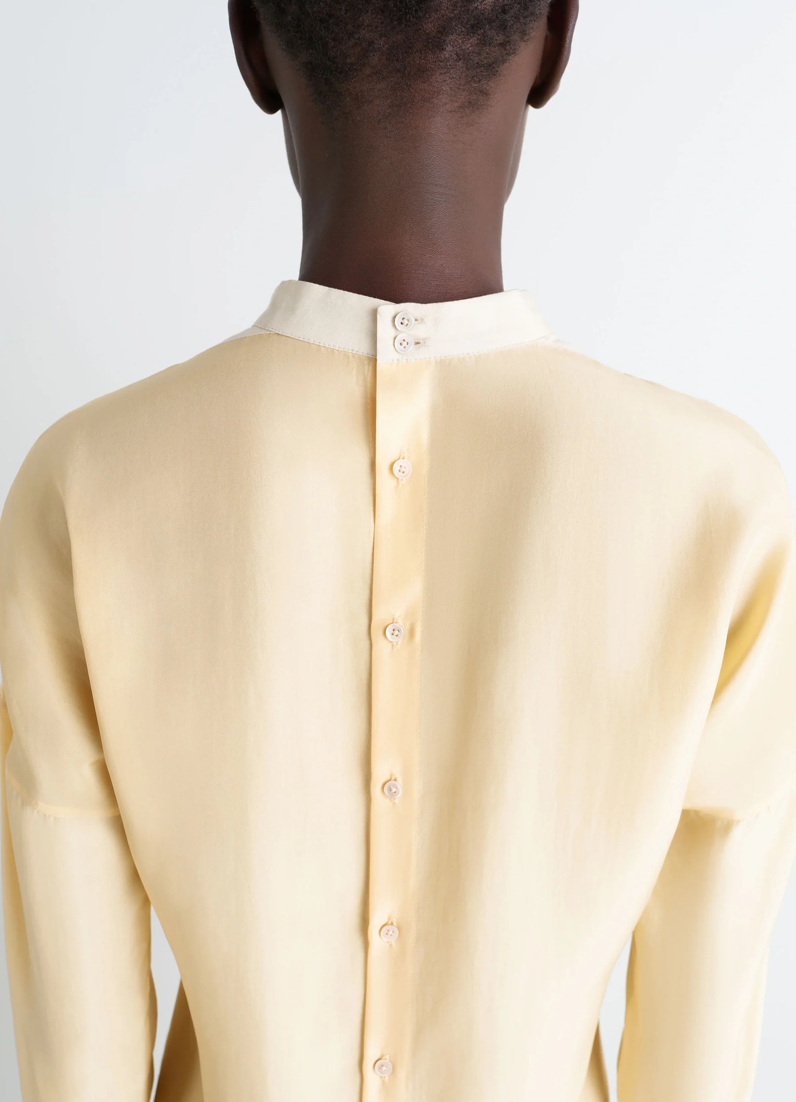 Light plastron top in silk pongee, model shot, back detail shot minimalist collar