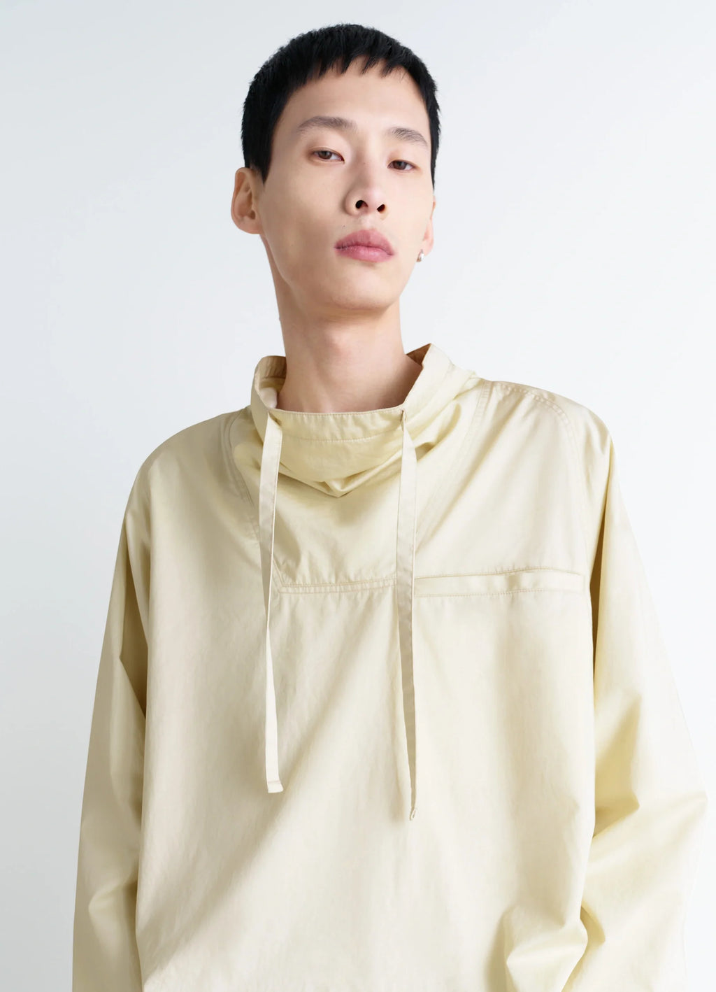 Lemaire Funnel Neck Vareuse in Lightweight Cotton Satin, model shot, close-up view drawstring neck detail