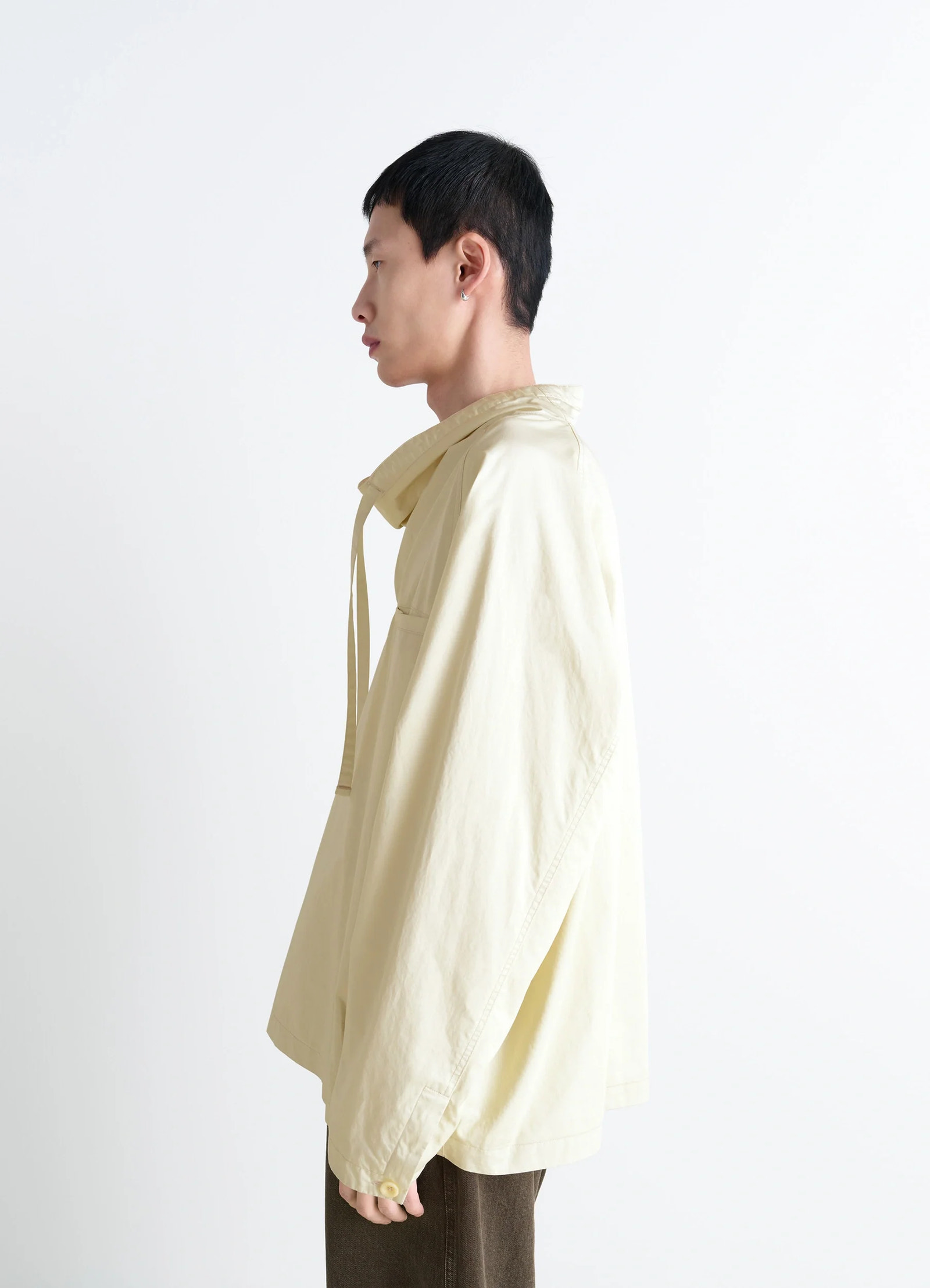 Lemaire funnel neck vareuse in lightweight cotton satin, model shot, side view dropped shoulder cut