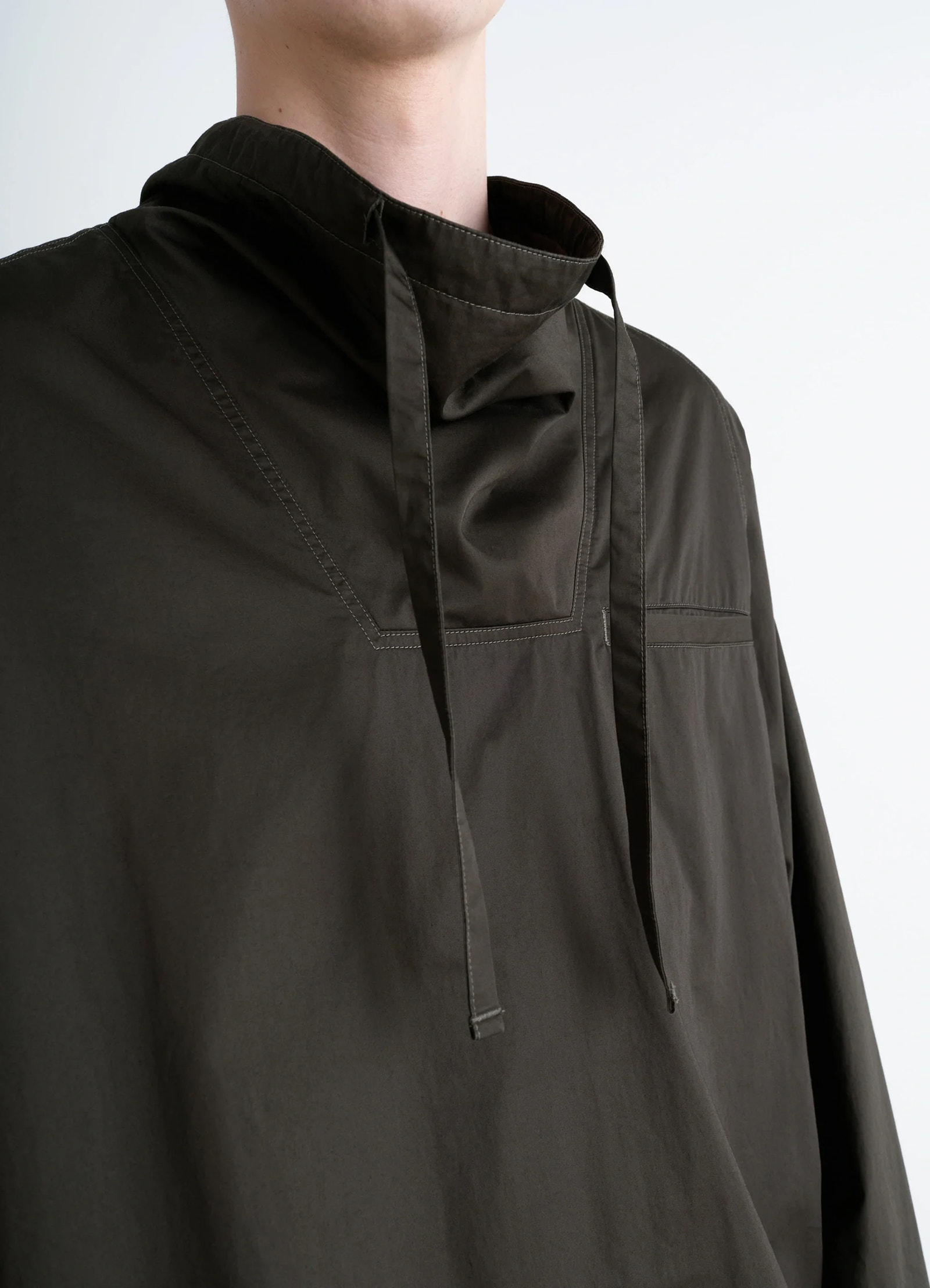 Lemaire funnel neck vareuse in dark olive lightweight cotton, model shot, detail shot funnel neck, long ties
