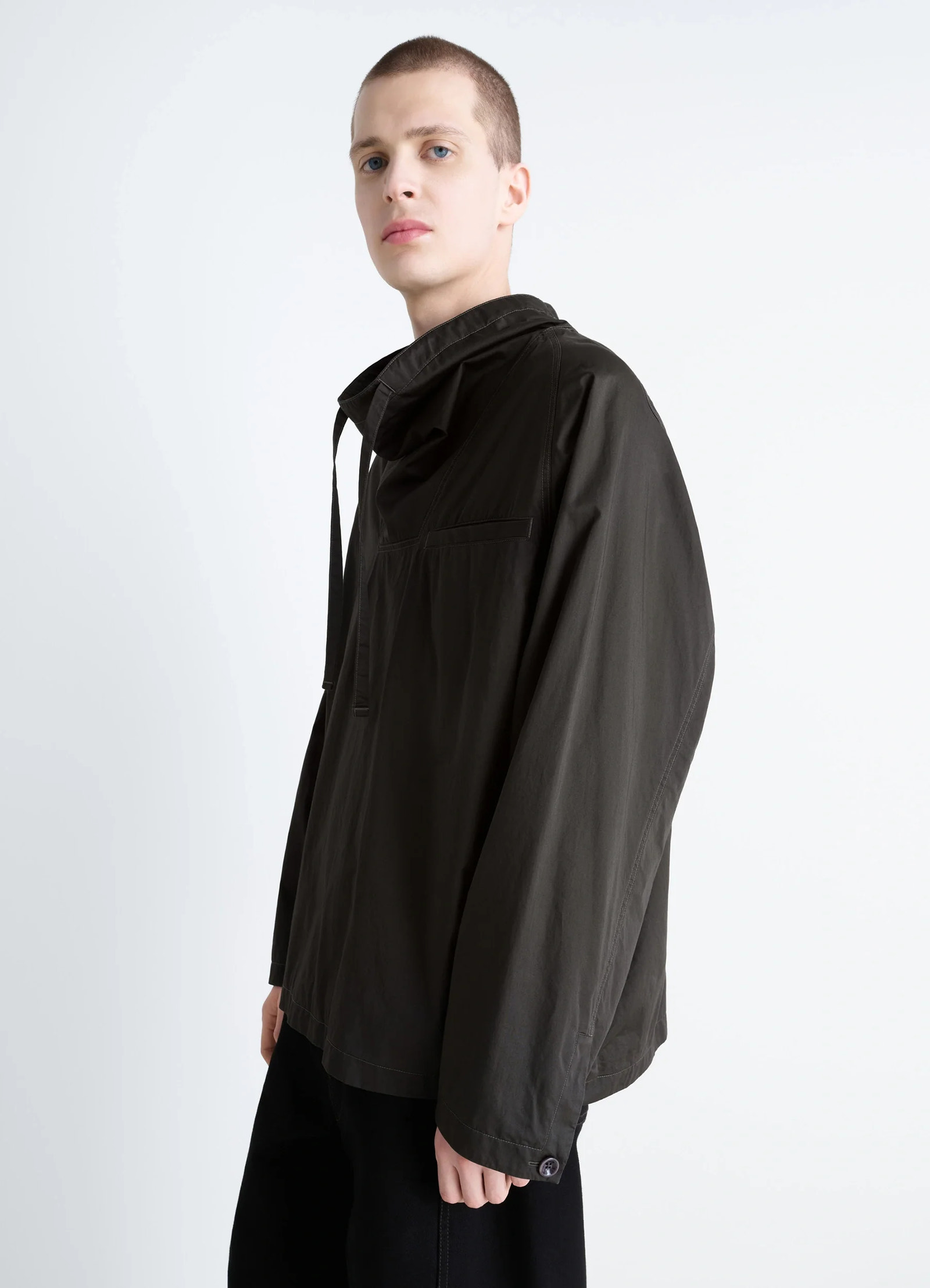 Lemaire funnel neck vareuse in dark olive lightweight cotton, model shot, side profile button cuff