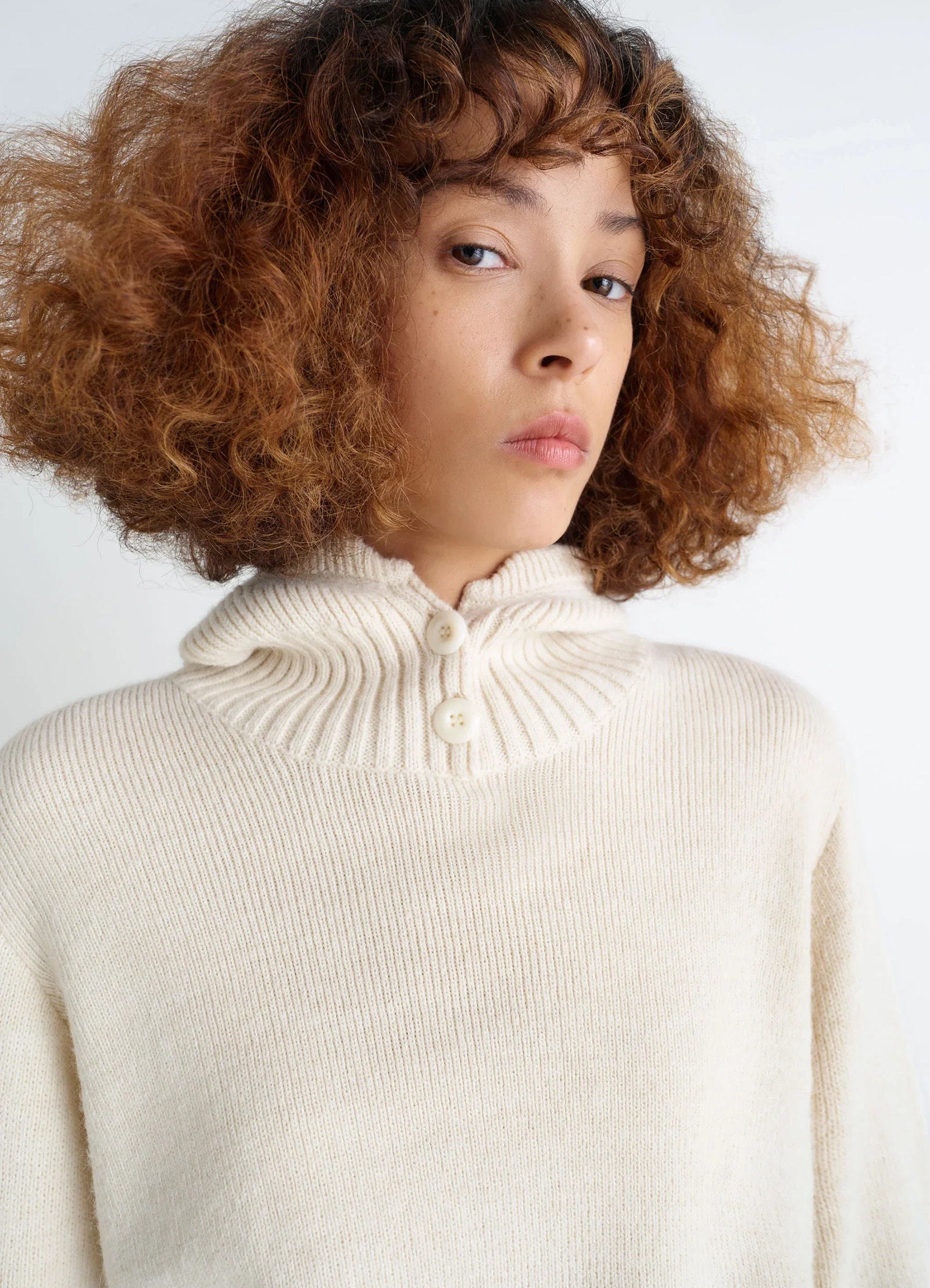Lemaire hooded sweater in cream wool alpaca blend, model shot, close-up detail button-down hooded