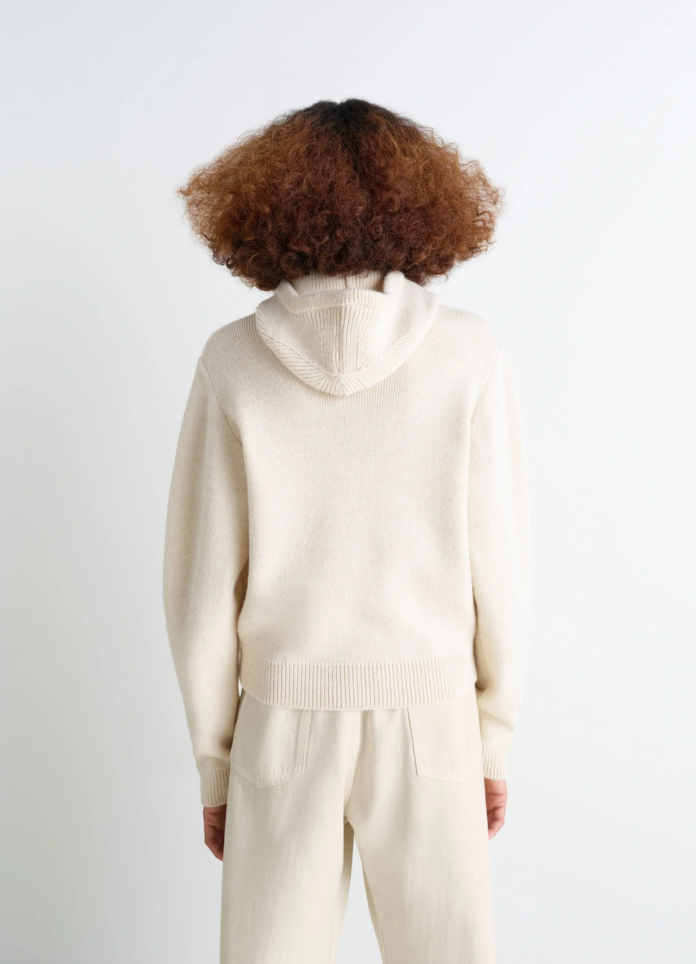 Lemaire Hooded Sweater in Cream Wool Alpaca Blend, model shot, back view ribbed hem detail