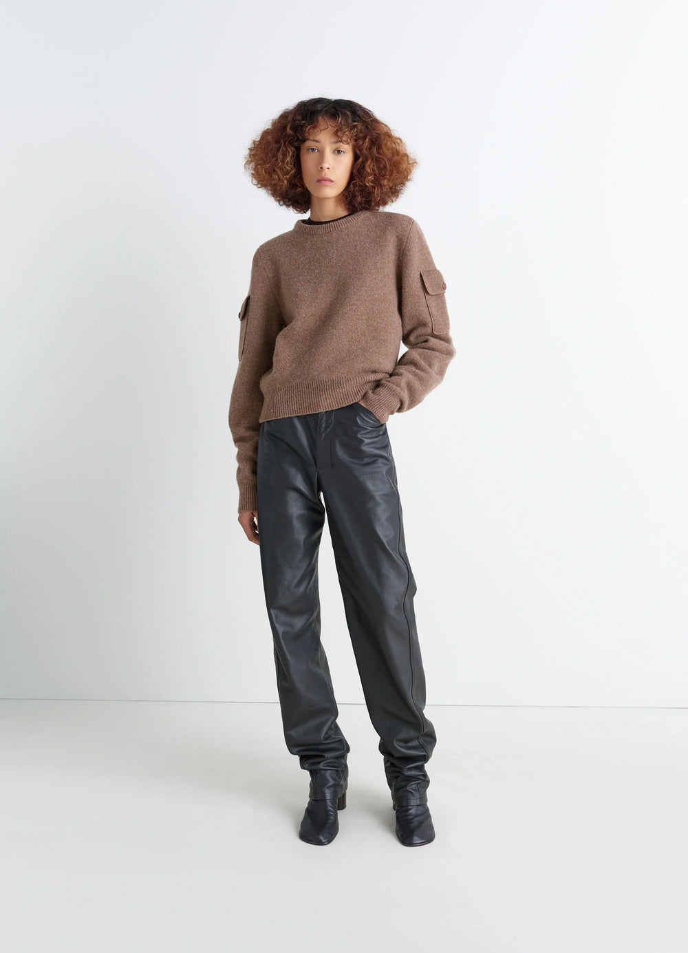 Shetland Wool Pocketed Sweater in Brown Shetland Wool, model shot, full body view long sleeves with buttoned pockets