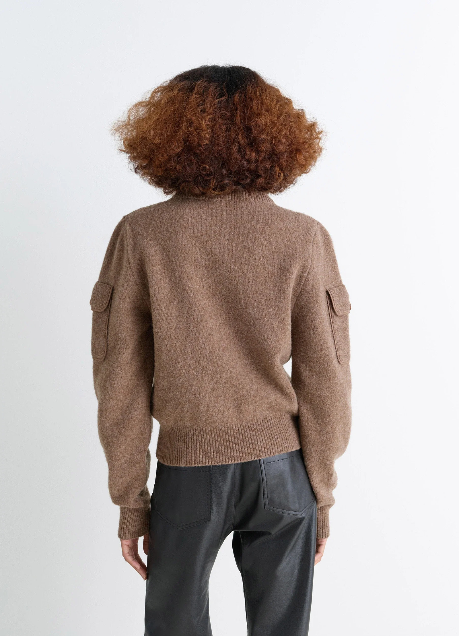 Shetland wool pocketed sweater in brown shetland wool, model shot, back view ribbed hem and cuffs