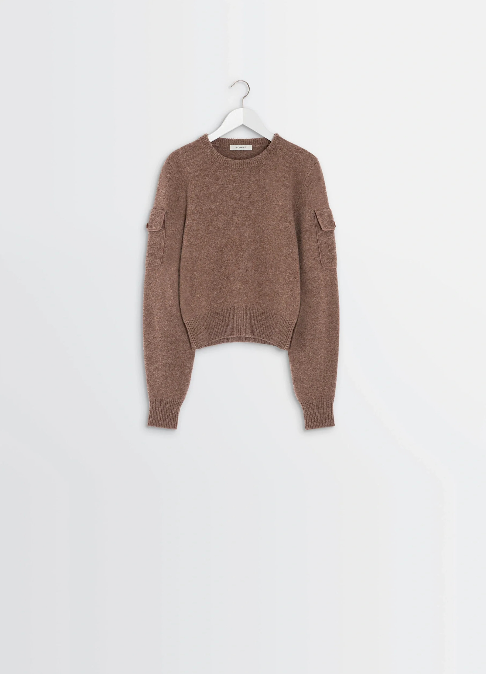Shetland wool pocketed sweater in brown shetland wool, product shot, frontal hanger view ribbed neckline and pockets