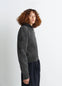 SWEATER WITH POCKETS in Shetland wool grey, model shot, side view ribbed cuffs and hem