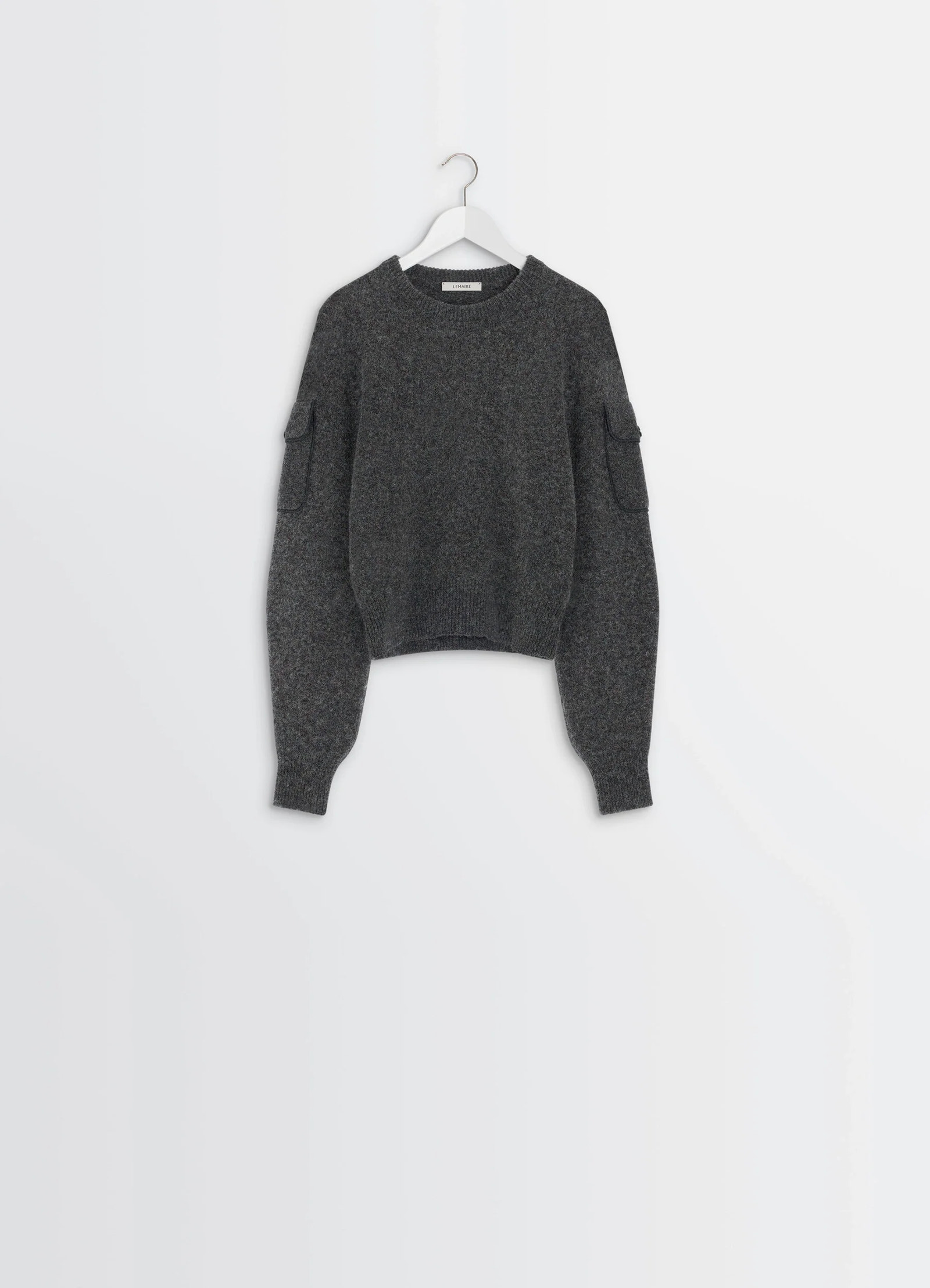 Sweater with pockets in shetland wool grey, product shot, hanging view cropped length