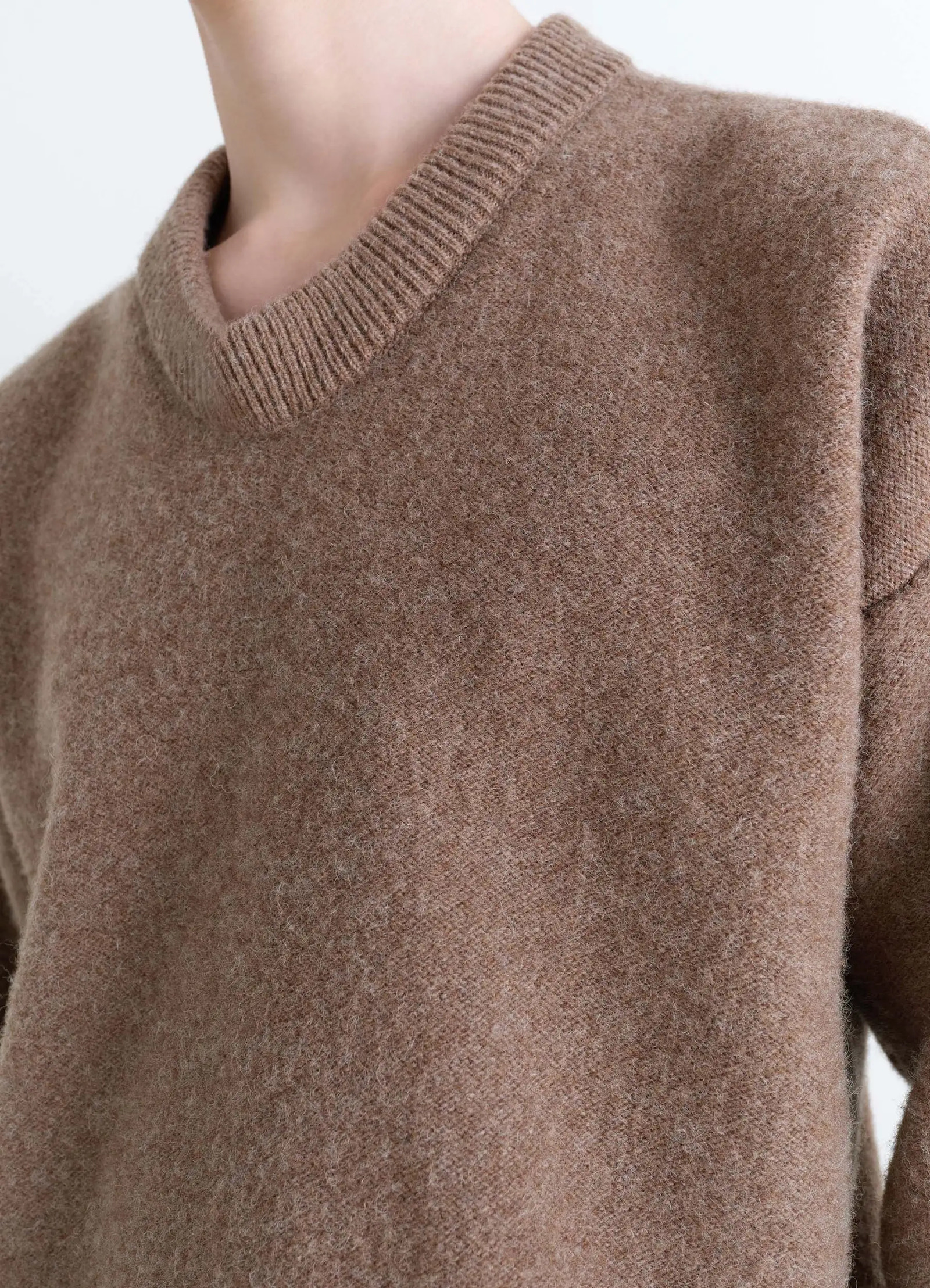 Boxy v neck sweater in shetland wool, model shot, close-up detail ribbed neckline