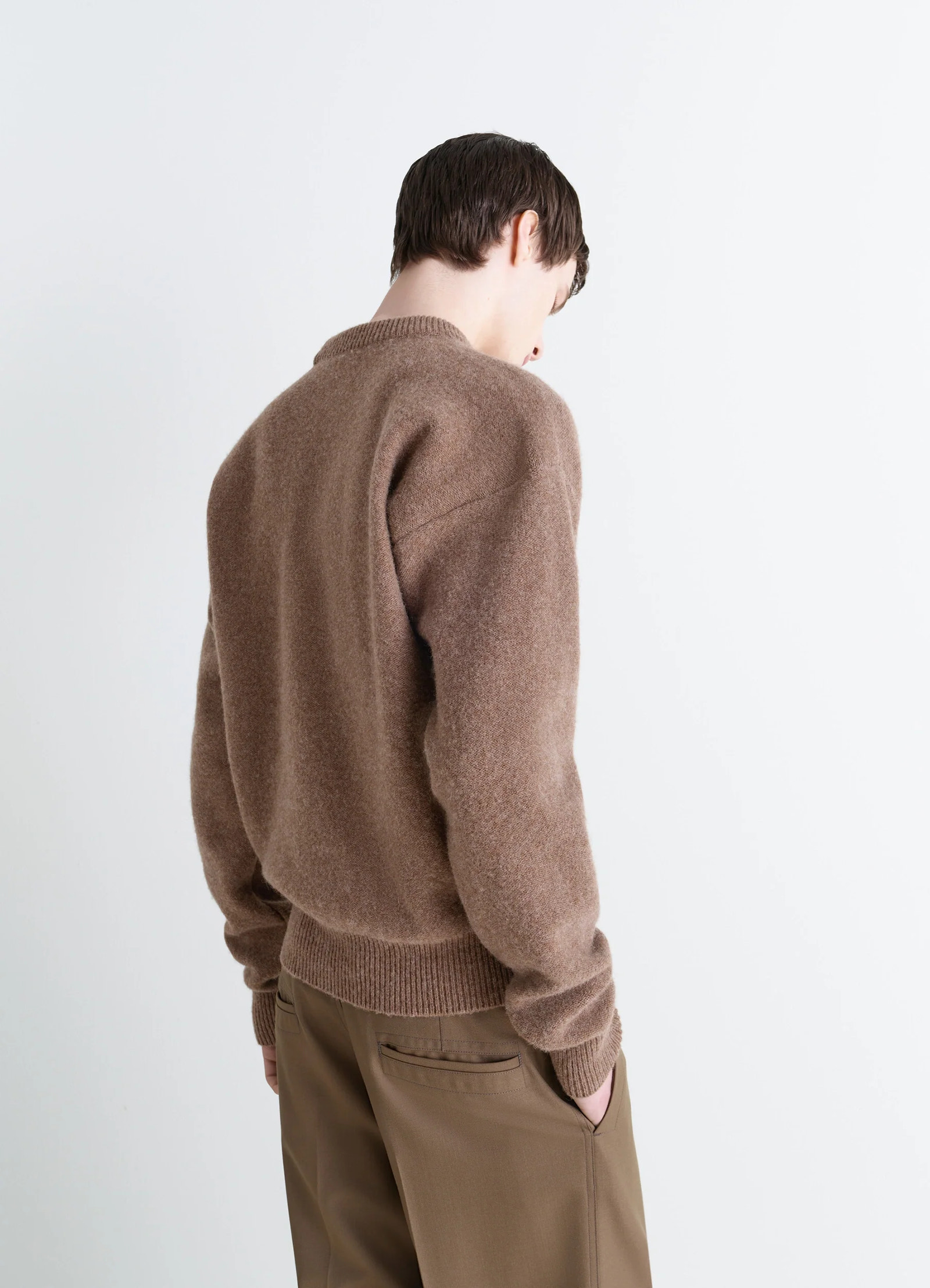 Boxy v neck sweater in shetland wool, model shot, back view dropped shoulders