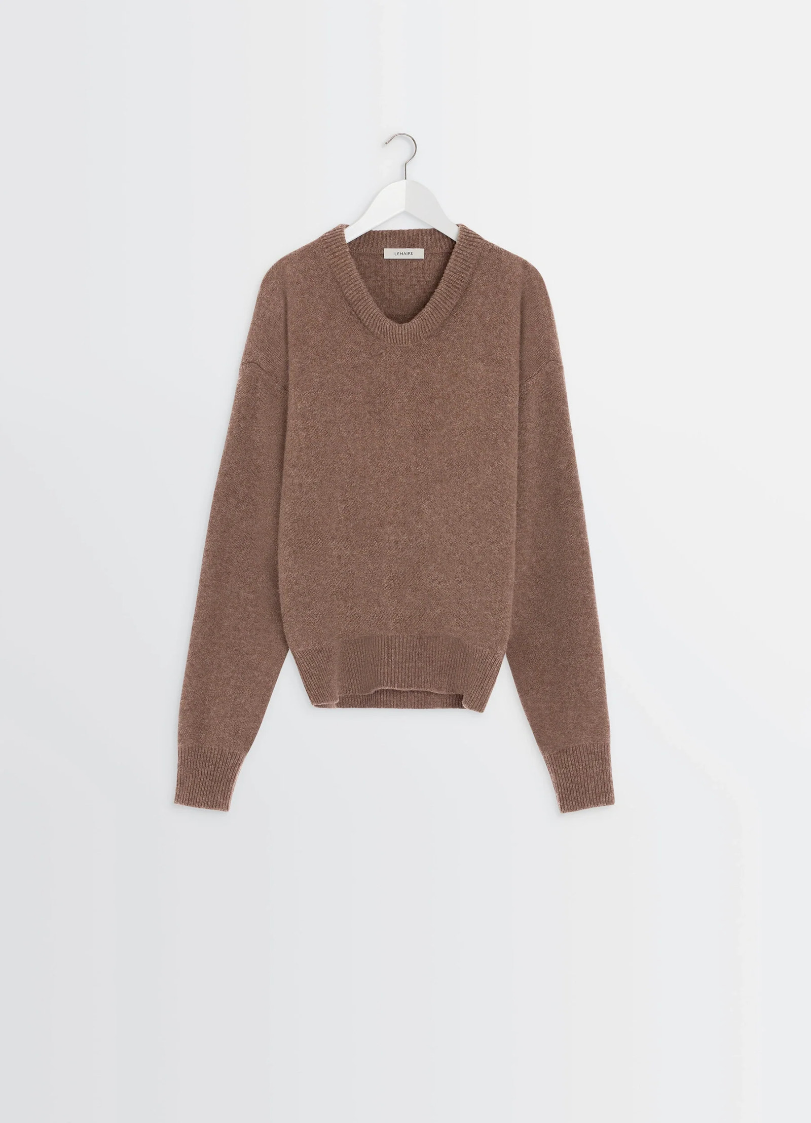 Boxy v neck sweater in shetland wool, product shot, hanger front view curved hem feature