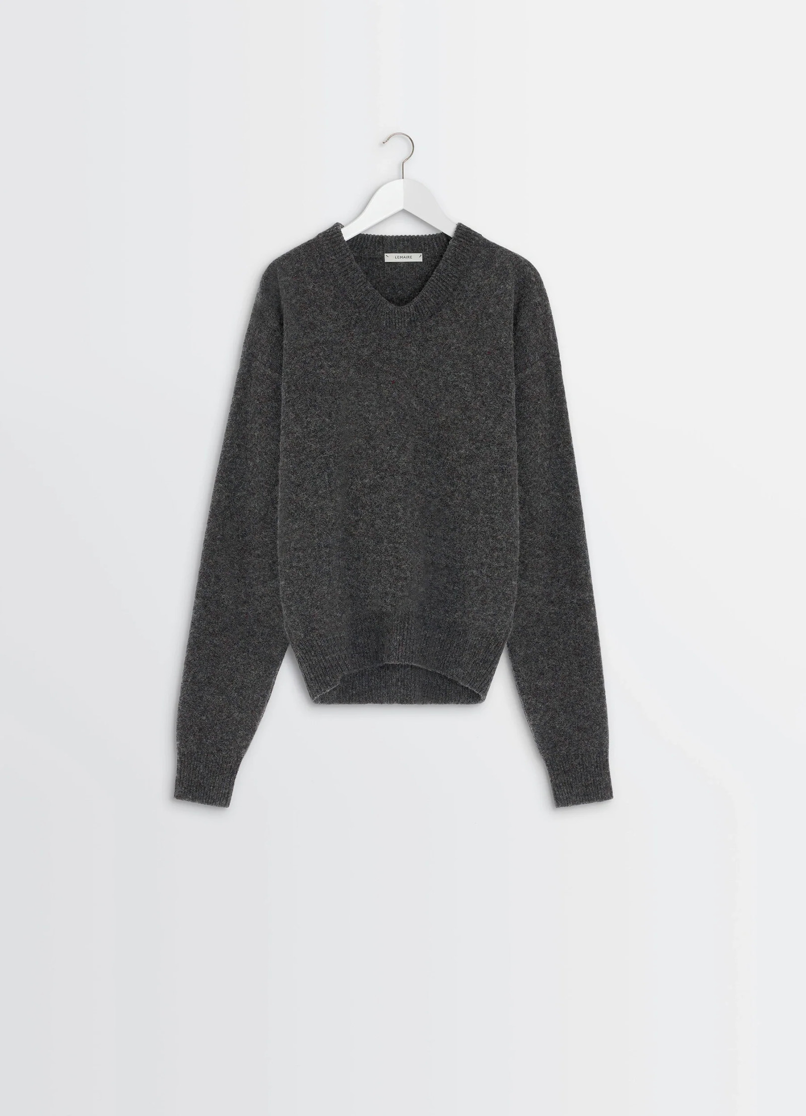 Boxy v neck sweater in shetland wool, product shot, front view ribbed cuffs