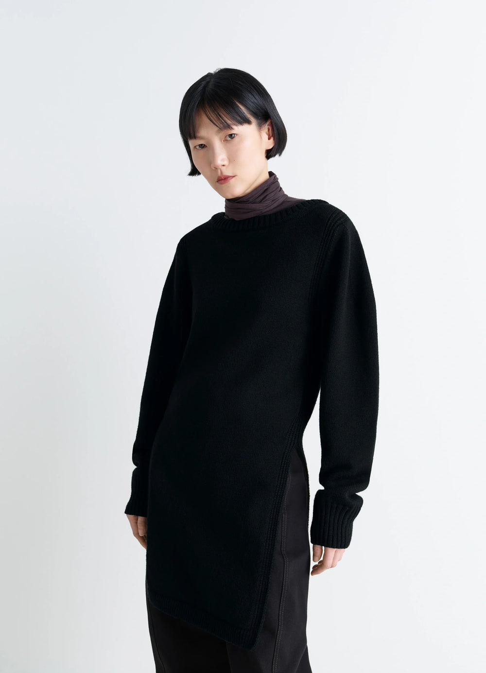 Sweater with Slits in Combed Wool Black, model shot, side view ribbed cuffs