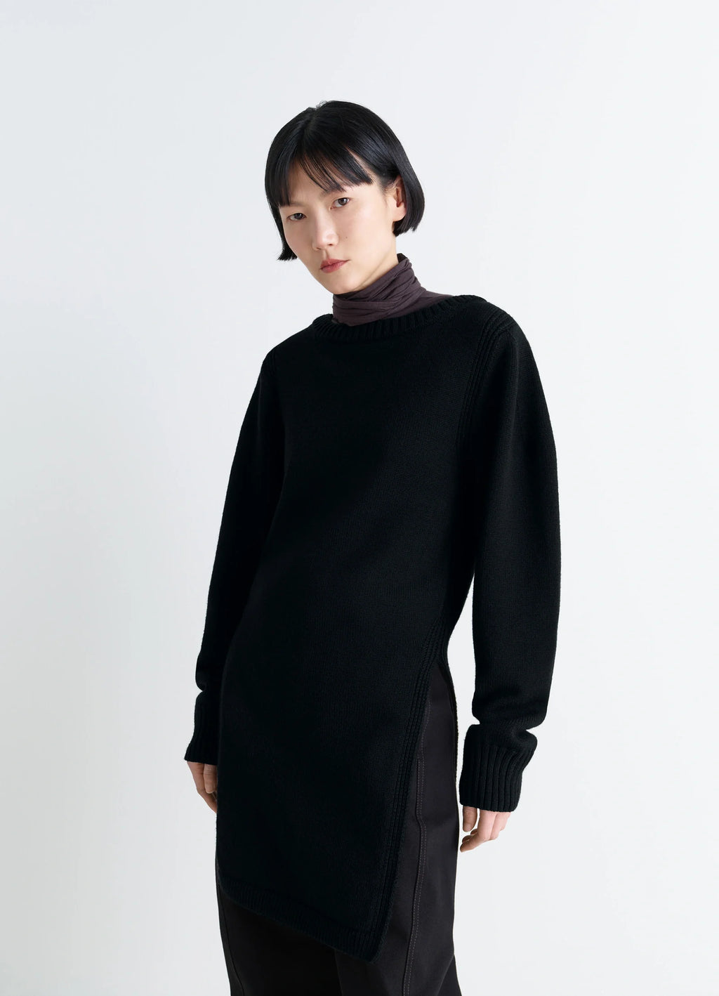 Sweater with Slits in Combed Wool Black, model shot, side view ribbed cuffs