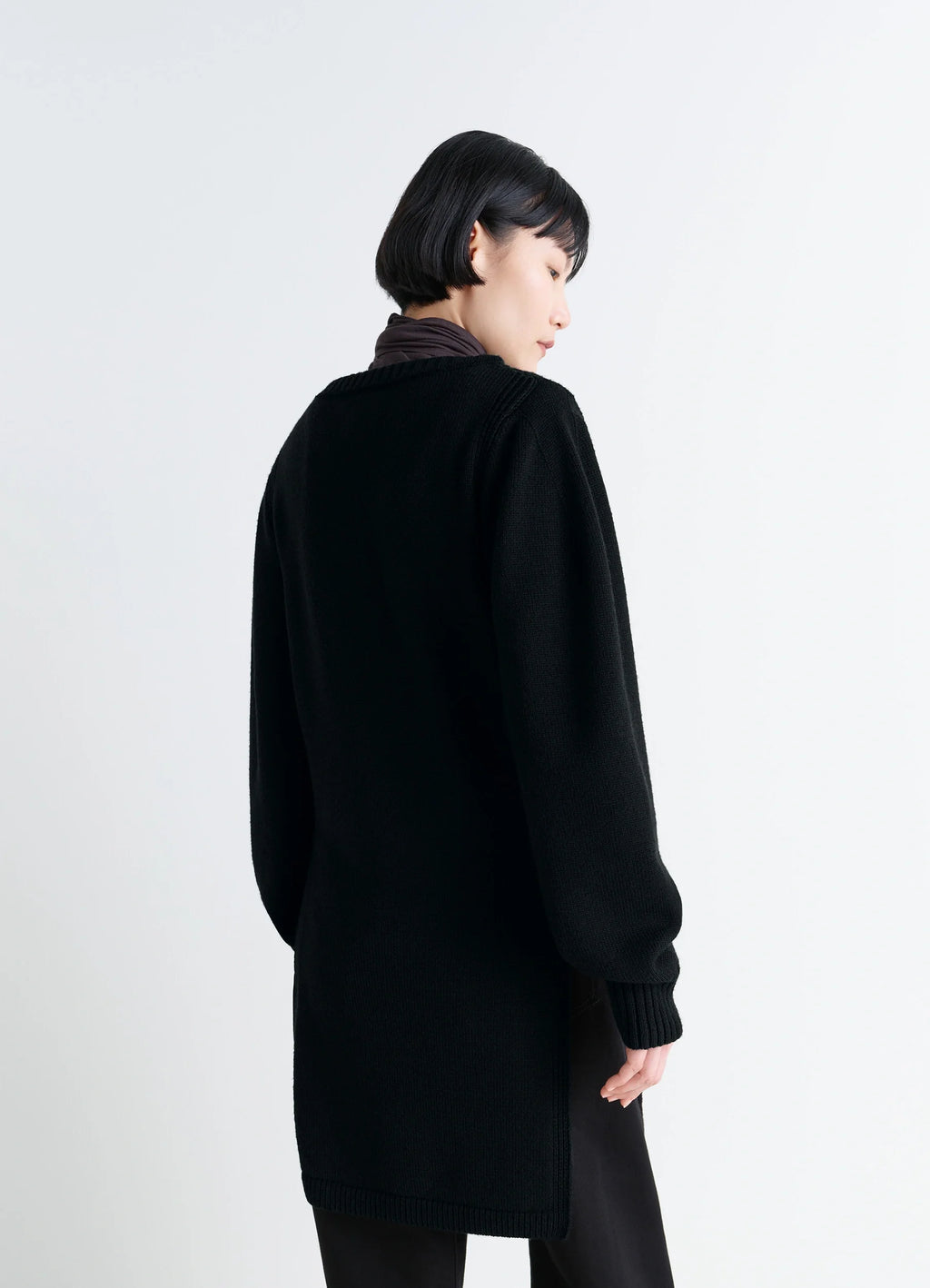 Sweater with Slits in Combed Wool Black, model shot, back view loose fit silhouette
